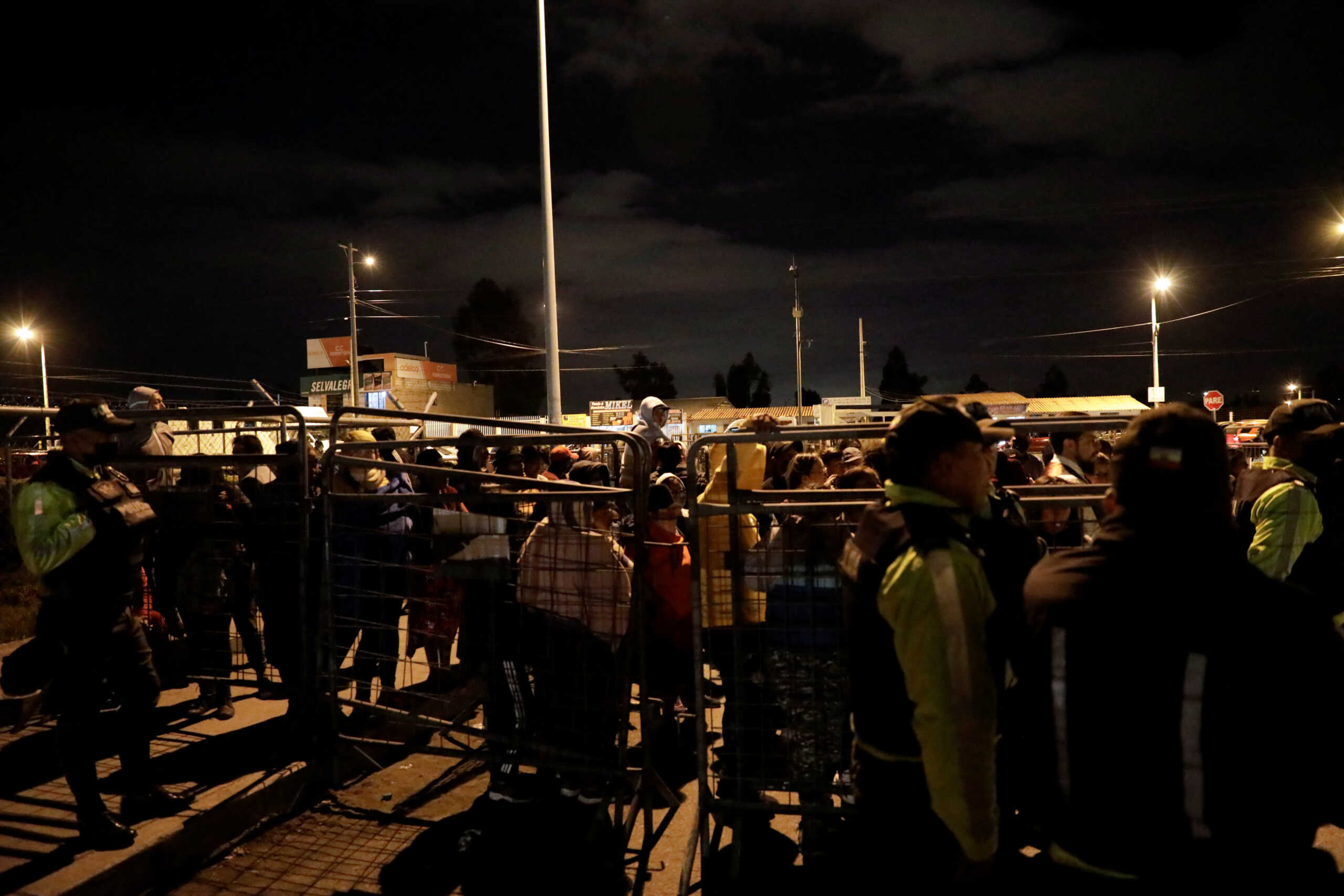 Family members of inmates wait outside the Cotopaxi No 1 penitentiary for news on their loved ones, in Latacunga, Ecuador October 3, 2022. REUTERS