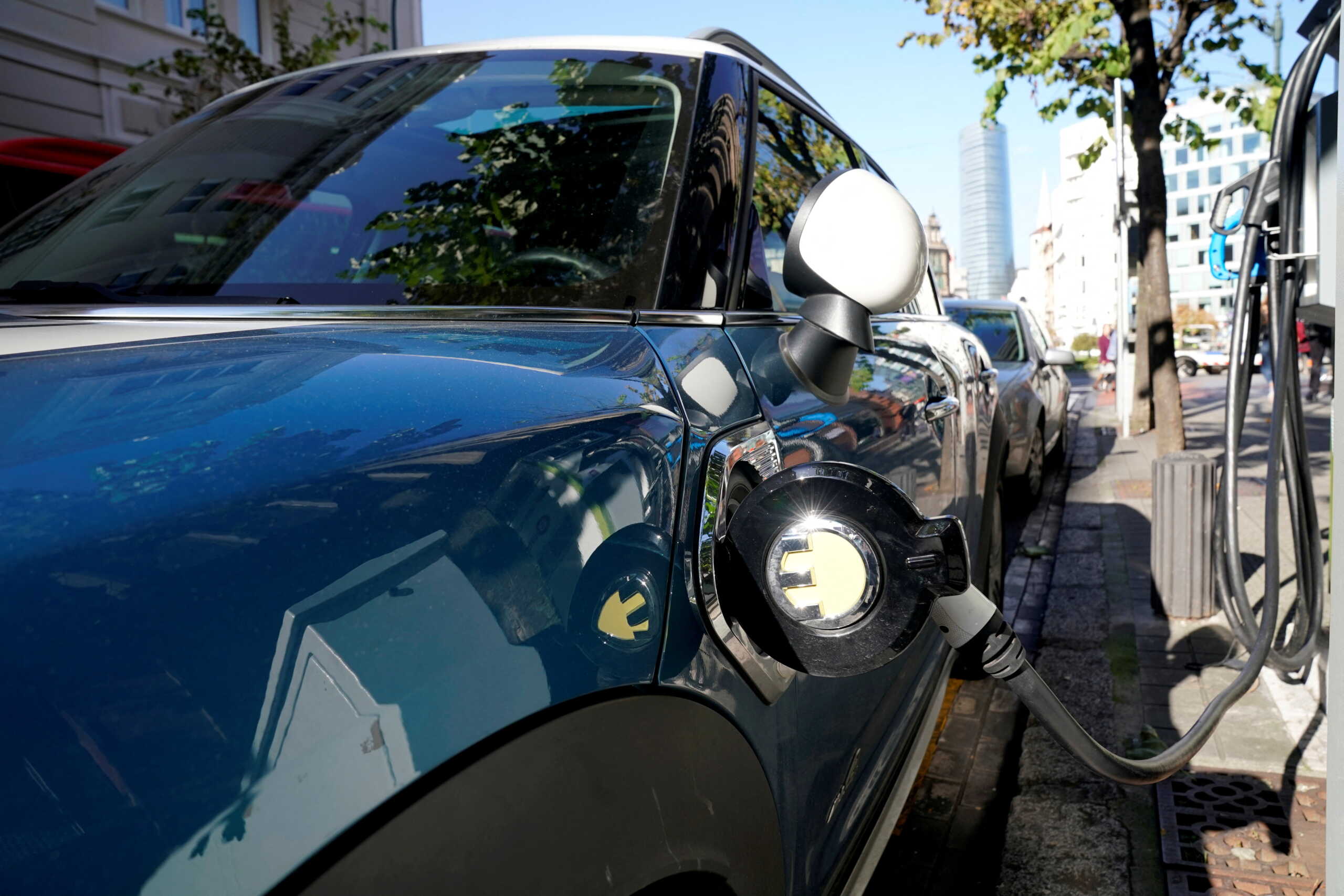 FILE PHOTO: An electric car is charged from a charging station in central Bilbao, Spain, November 15, 2018. REUTERS