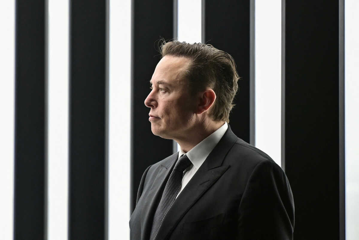 FILE PHOTO: Elon Musk attends the opening ceremony of the new Tesla Gigafactory for electric cars in Gruenheide, Germany, March 22, 2022. Patrick Pleul