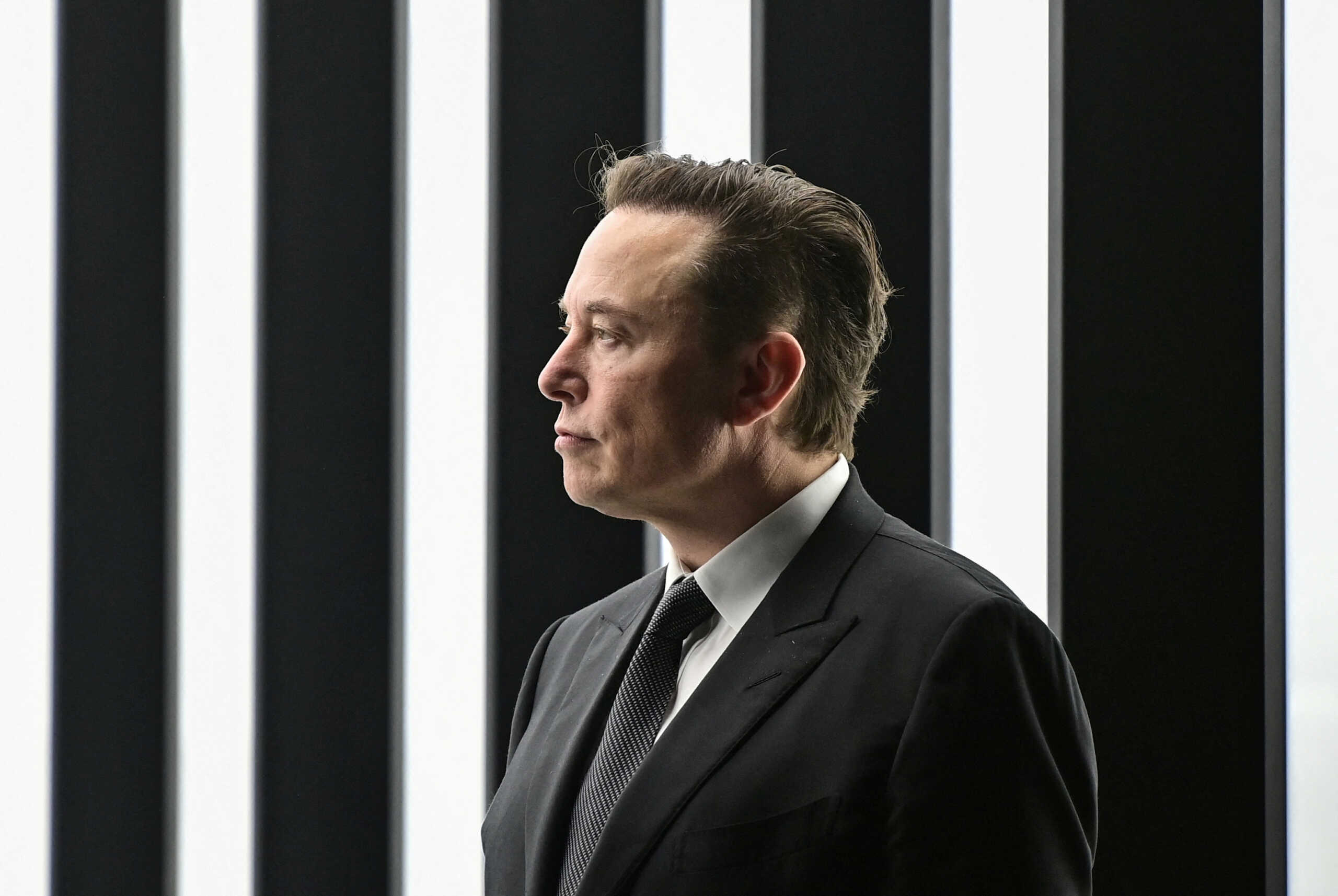 FILE PHOTO: Elon Musk attends the opening ceremony of the new Tesla Gigafactory for electric cars in Gruenheide, Germany, March 22, 2022. Patrick Pleul