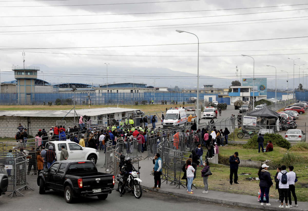 Family members of inmates stand outside the Cotopaxi No 1 penitentiary where several people have been killed and injured during a riot, in Latacunga, Ecuador October 4, 2022. REUTERS