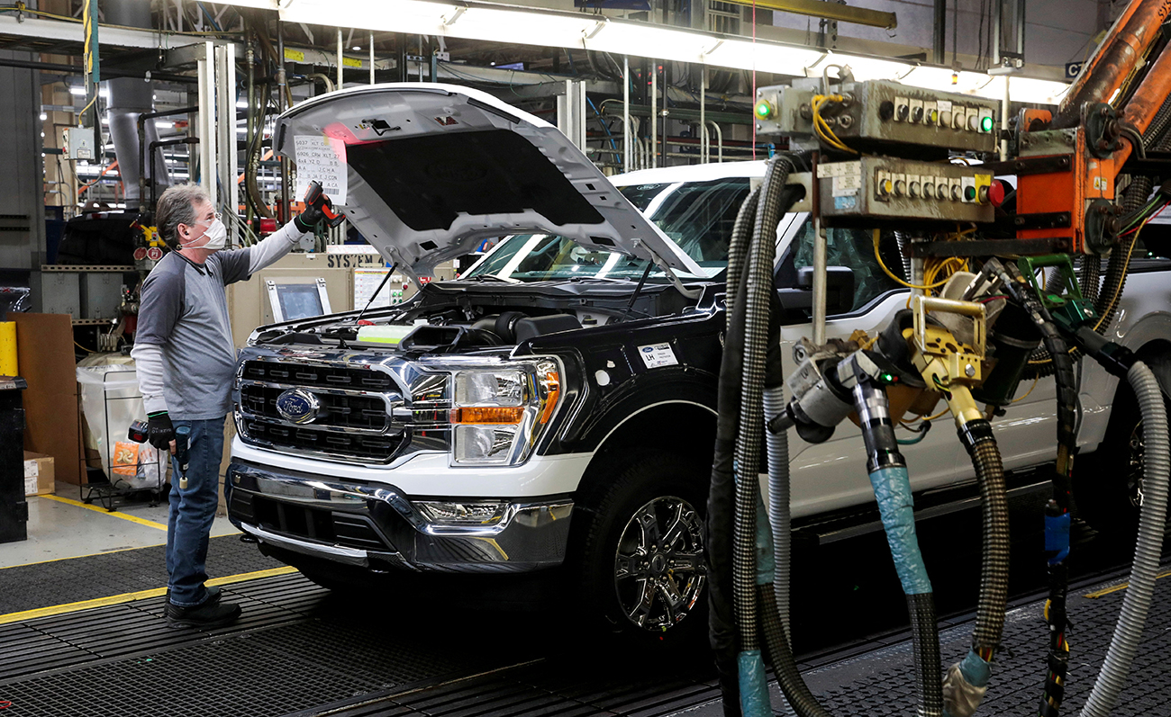 FILE PHOTO: An assembly worker of Ford Motor works on an F-series pickup truck at the Dearborn Truck Plant in Dearborn, Michigan, U.S., January 26, 2022. Picture taken January 26, 2022. REUTERS