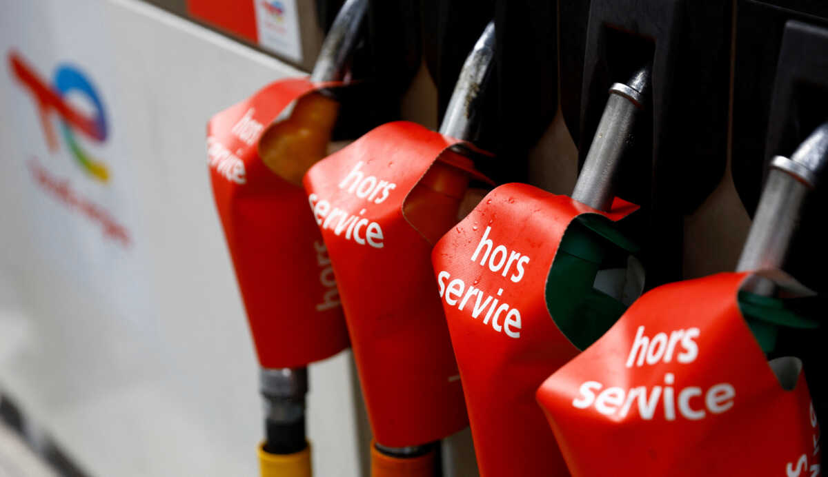 Signs which read "out of order" are seen on gasoline pumps at a closed TotalEnergies gas station in Paris as part of a nationwide day of strike and protests for wages and against requisitions at refineries in France, October 18, 2022. REUTERS
