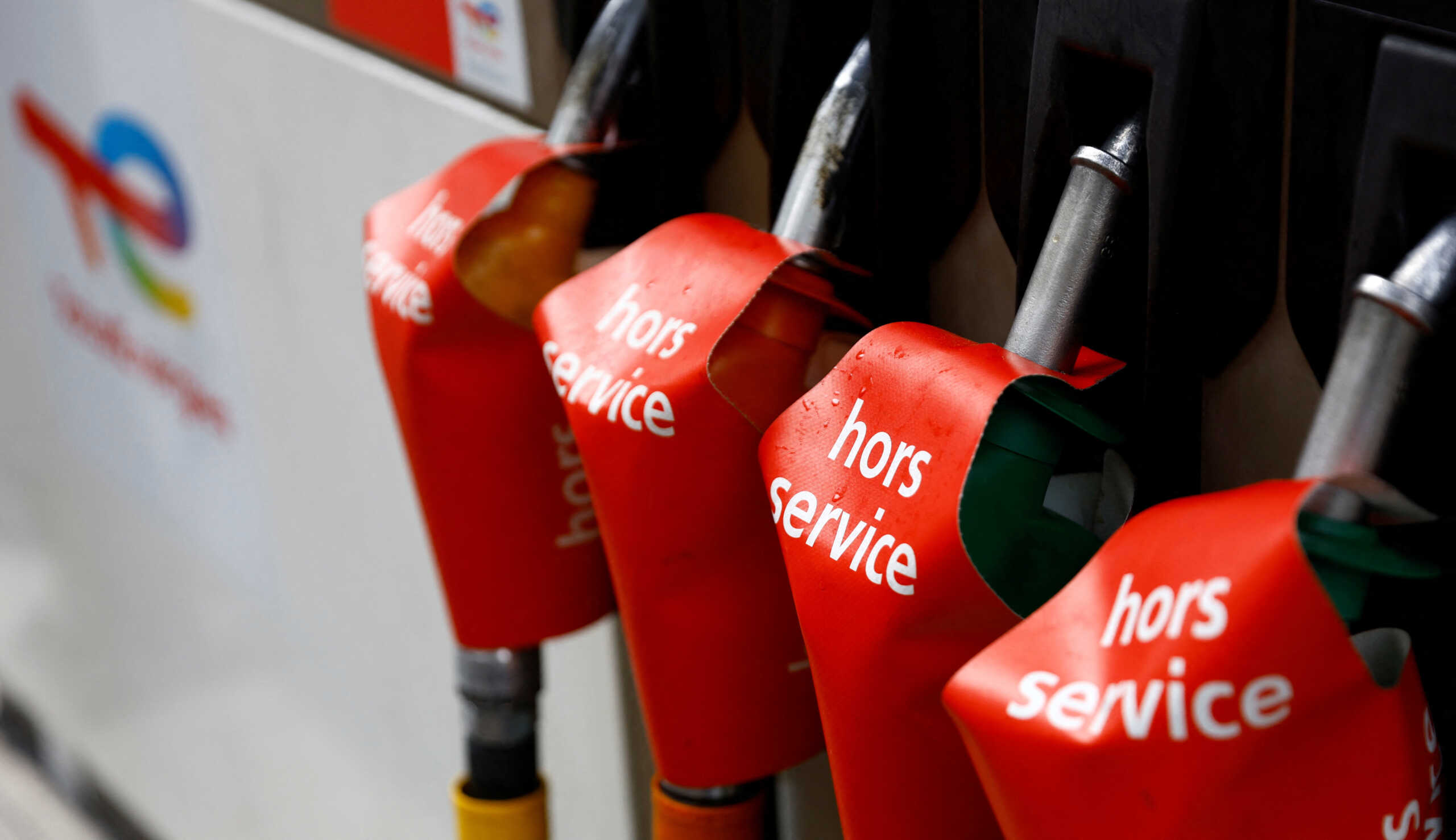 Signs which read "out of order" are seen on gasoline pumps at a closed TotalEnergies gas station in Paris as part of a nationwide day of strike and protests for wages and against requisitions at refineries in France, October 18, 2022. REUTERS