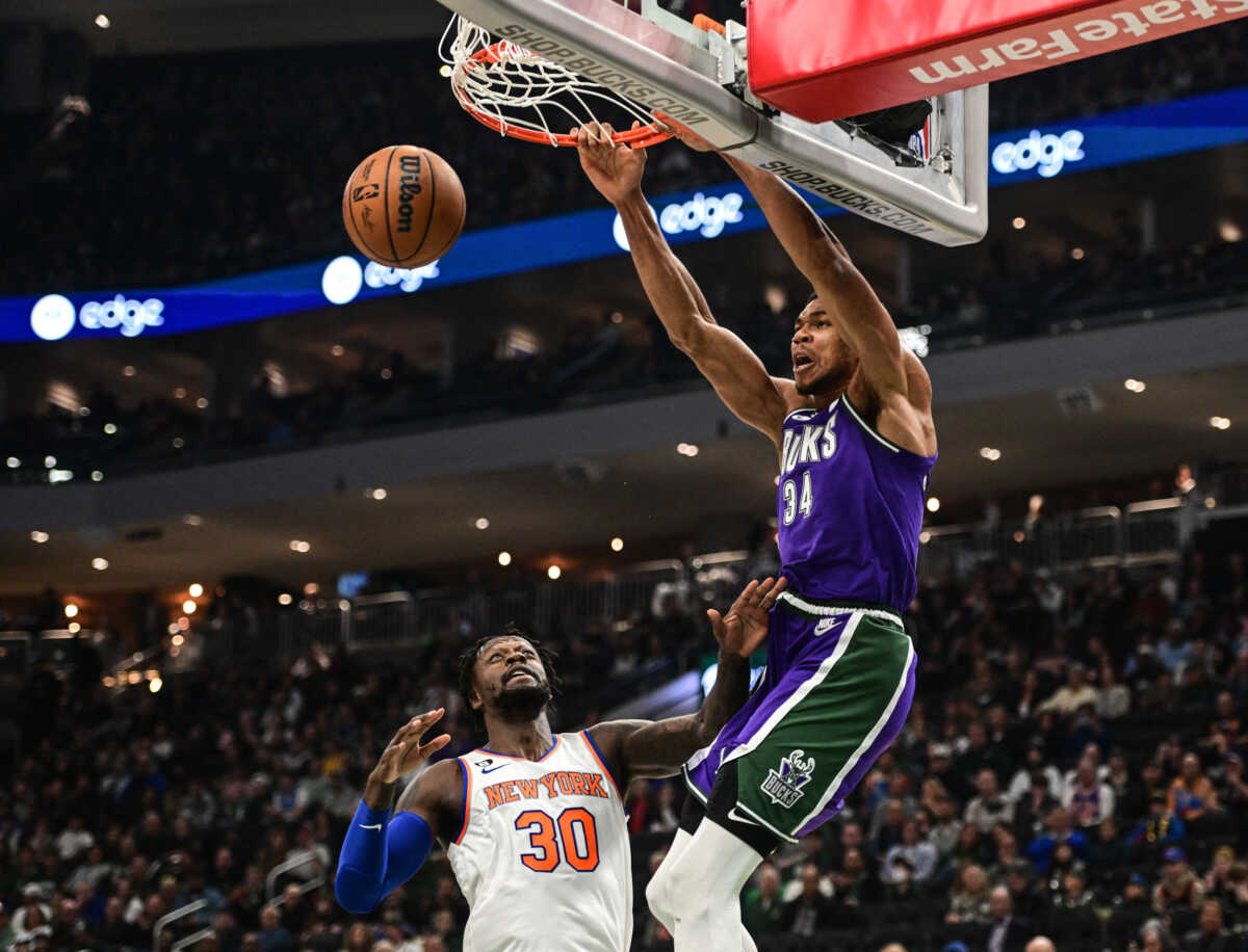 Oct 28, 2022; Milwaukee, Wisconsin, USA;  Milwaukee Bucks forward Giannis Antetokounmpo (34) dunks over New York Knicks forward Julius Randle (30) in the first quarter at Fiserv Forum. Mandatory Credit: Benny Sieu-USA TODAY Sports