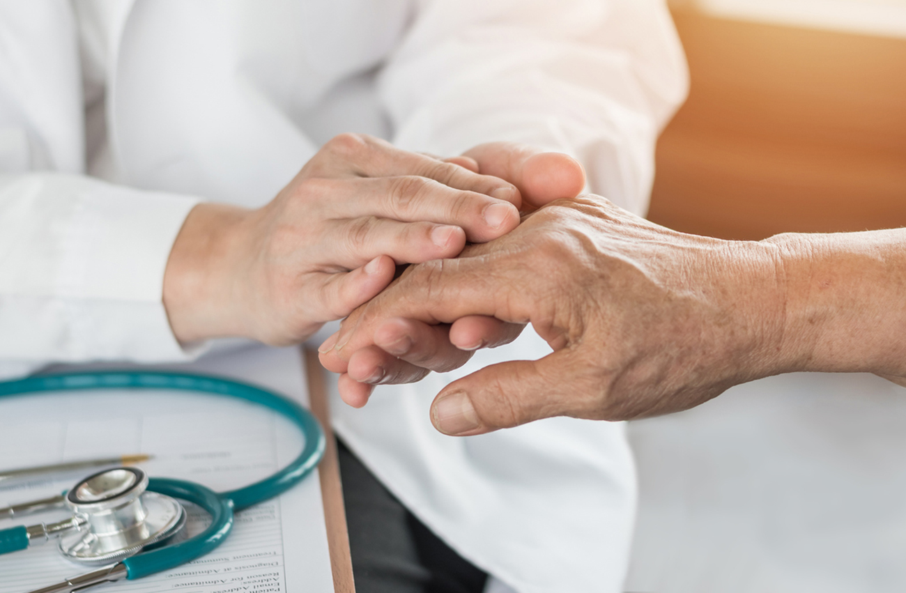 Elderly senior adult patient (older person) having geriatric doctor consulting and diagnostic examining on aging and mental health care in medical clinic office or hospital examination room