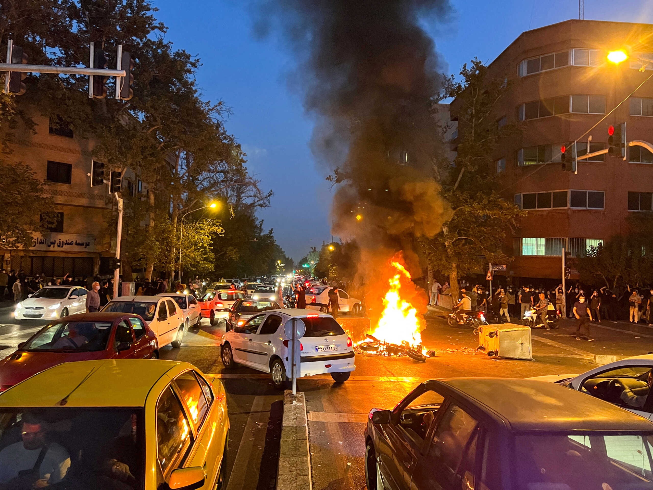 FILE PHOTO: A police motorcycle burns during a protest over the death of Mahsa Amini, a woman who died after being arrested by the Islamic republic's "morality police", in Tehran, Iran September 19, 2022. WANA (West Asia News Agency) via REUTERS ATTENTION EDITORS - THIS IMAGE HAS BEEN SUPPLIED BY A THIRD PARTY.   ATTENTION EDITORS - THIS PICTURE WAS PROVIDED BY A THIRD PARTY