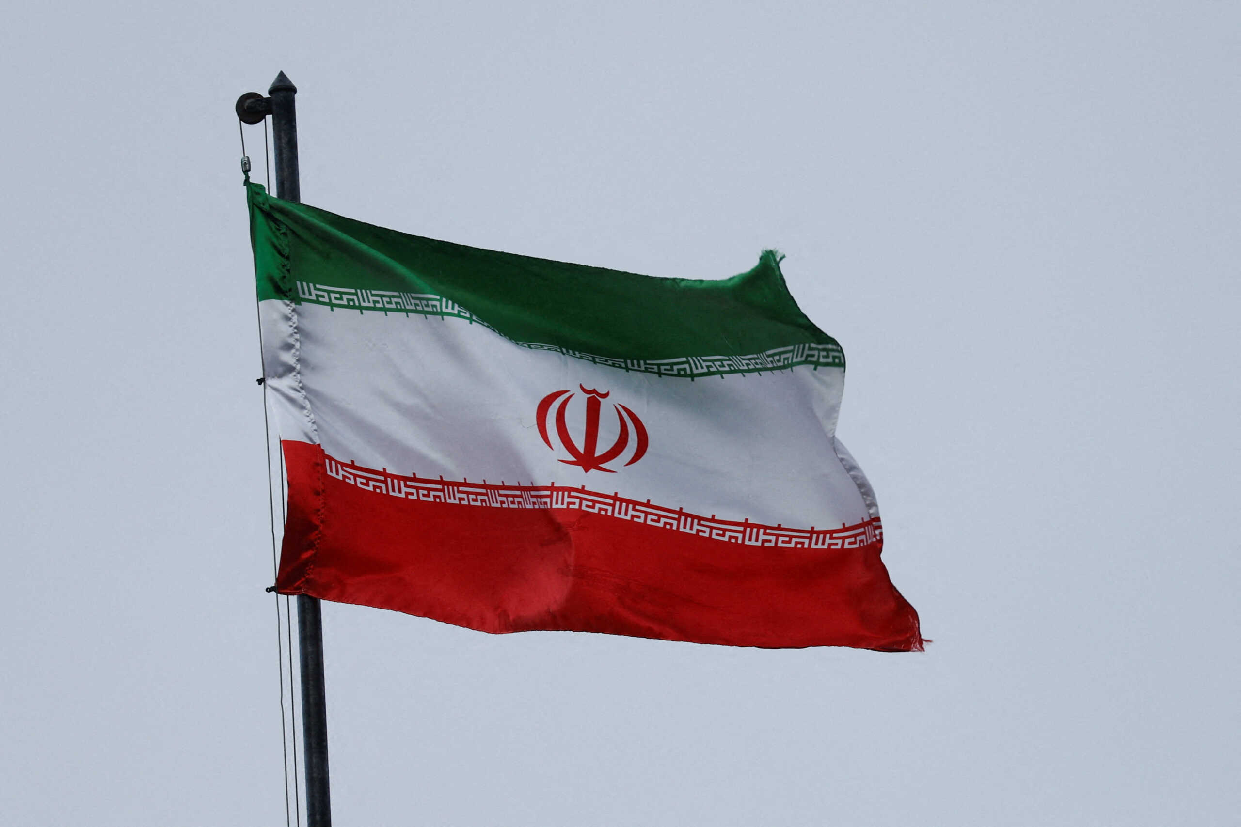 FILE PHOTO: A national Iranian flag waves in the wind over a building of the Iranian embassy, amid Russia's attack on Ukraine, in Kyiv, Ukraine September 24, 2022. REUTERS
