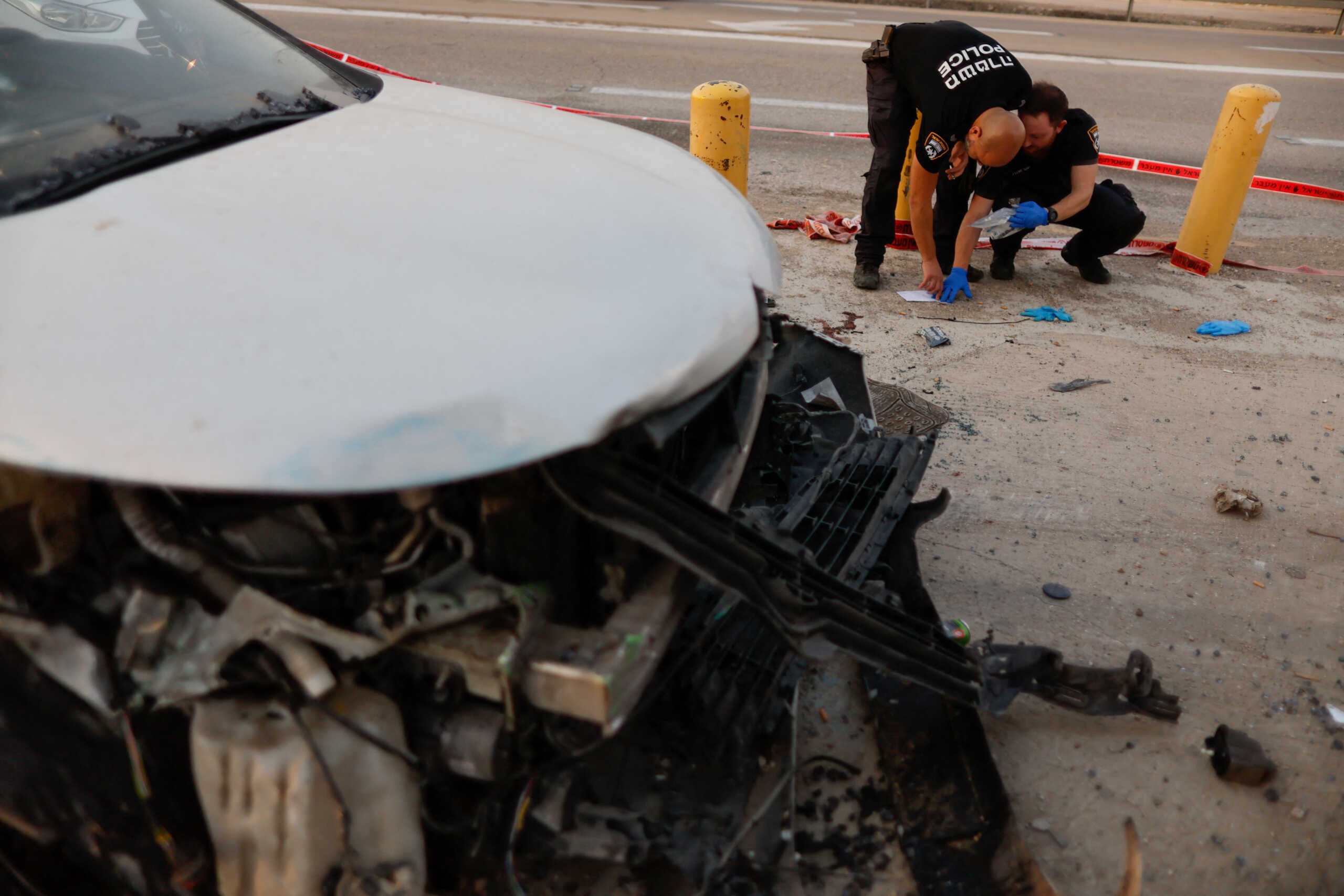 Members of Israeli forces secure the scene of a car ramming incident near Jericho in the Israeli-occupied West Bank October 30, 2022. REUTERS