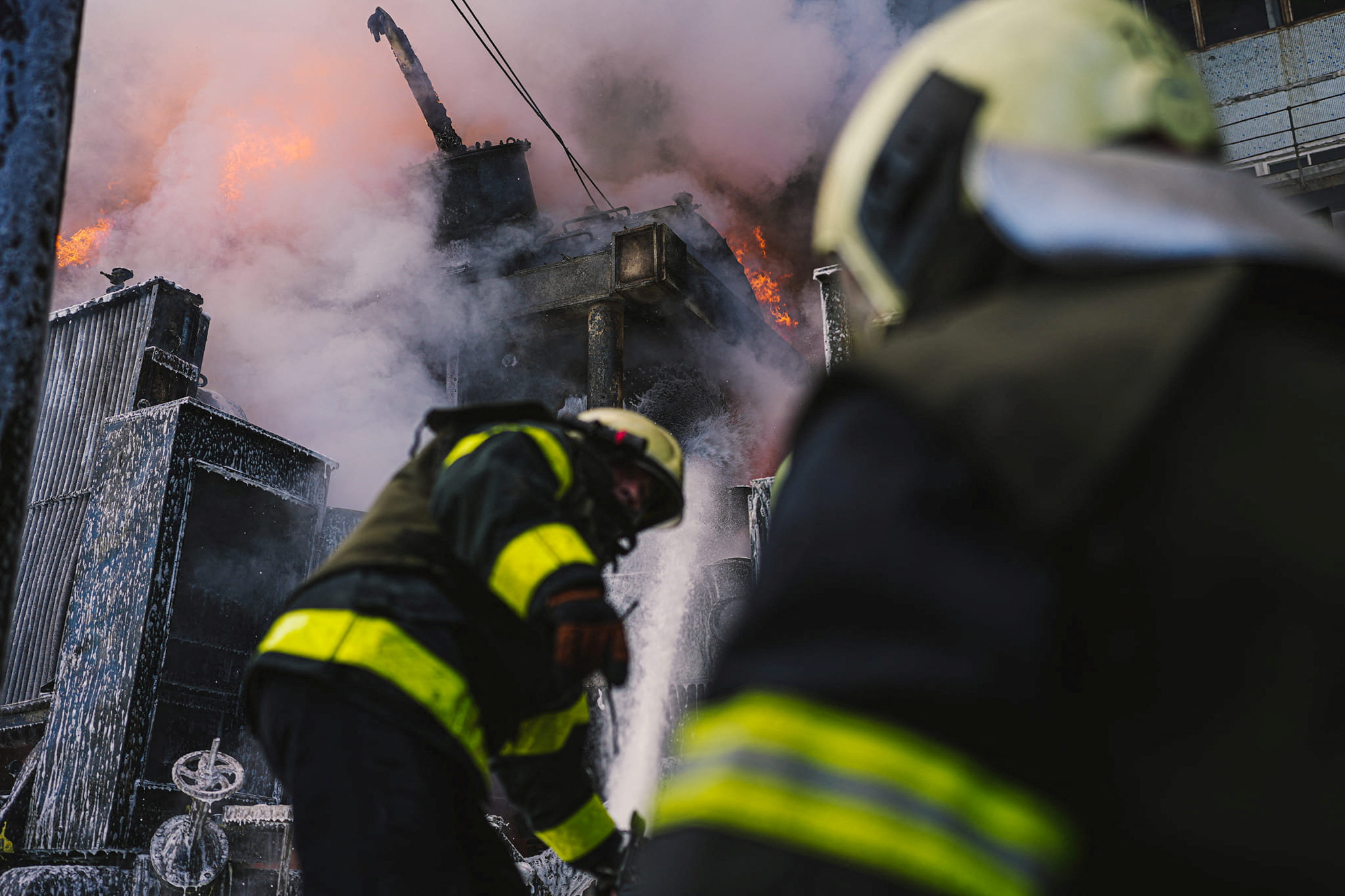 Firefighters work to put out a fire in a thermal power plant, damaged by a Russian missile strike in Kyiv, Ukraine, October 18, 2022.  State Emergency Service of Ukraine