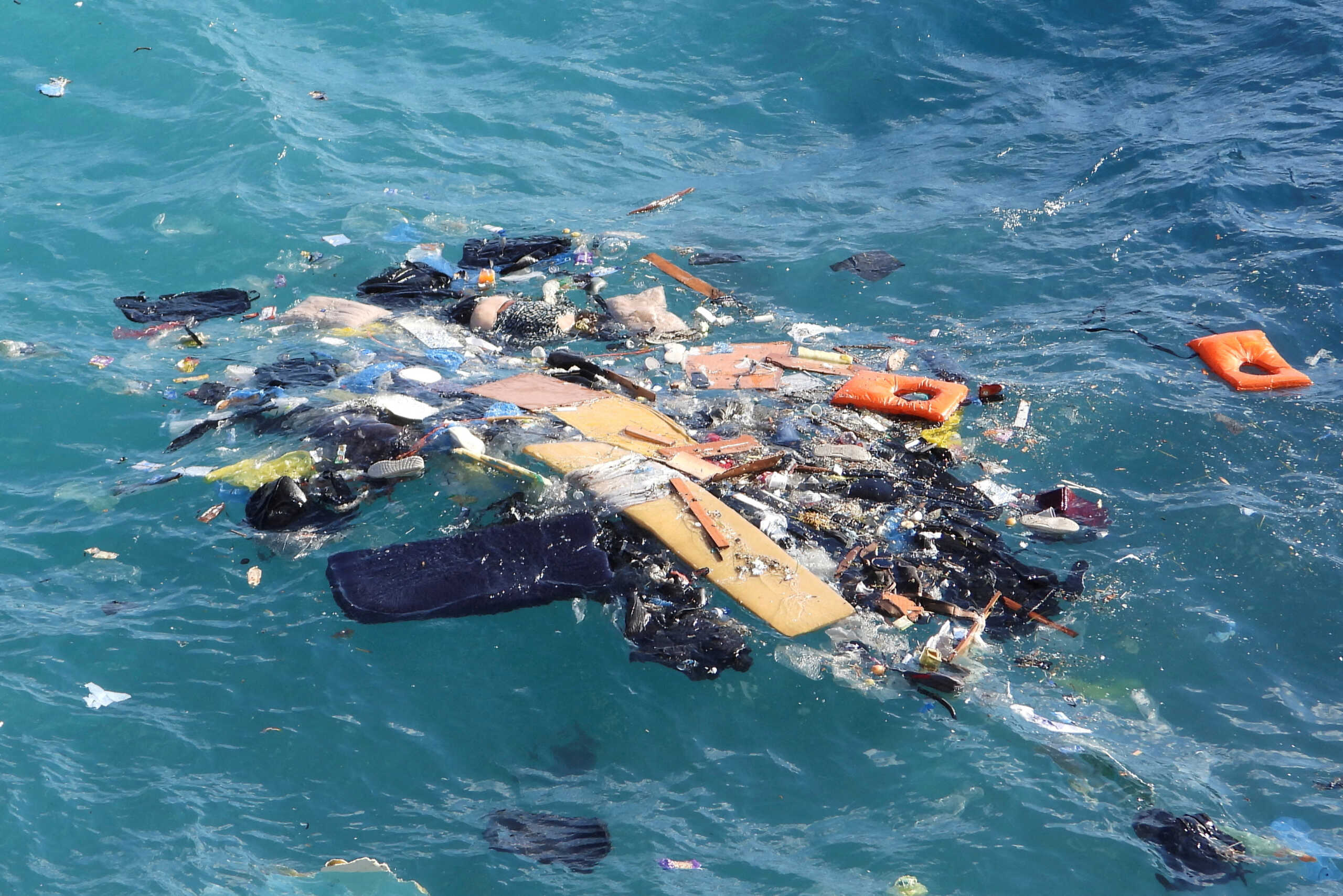 SENSITIVE MATERIAL. THIS IMAGE MAY OFFEND OR DISTURB  The body of a migrant floats among debris following a shipwreck, on the island of Kythira, Greece, October 5, 2022. REUTERS