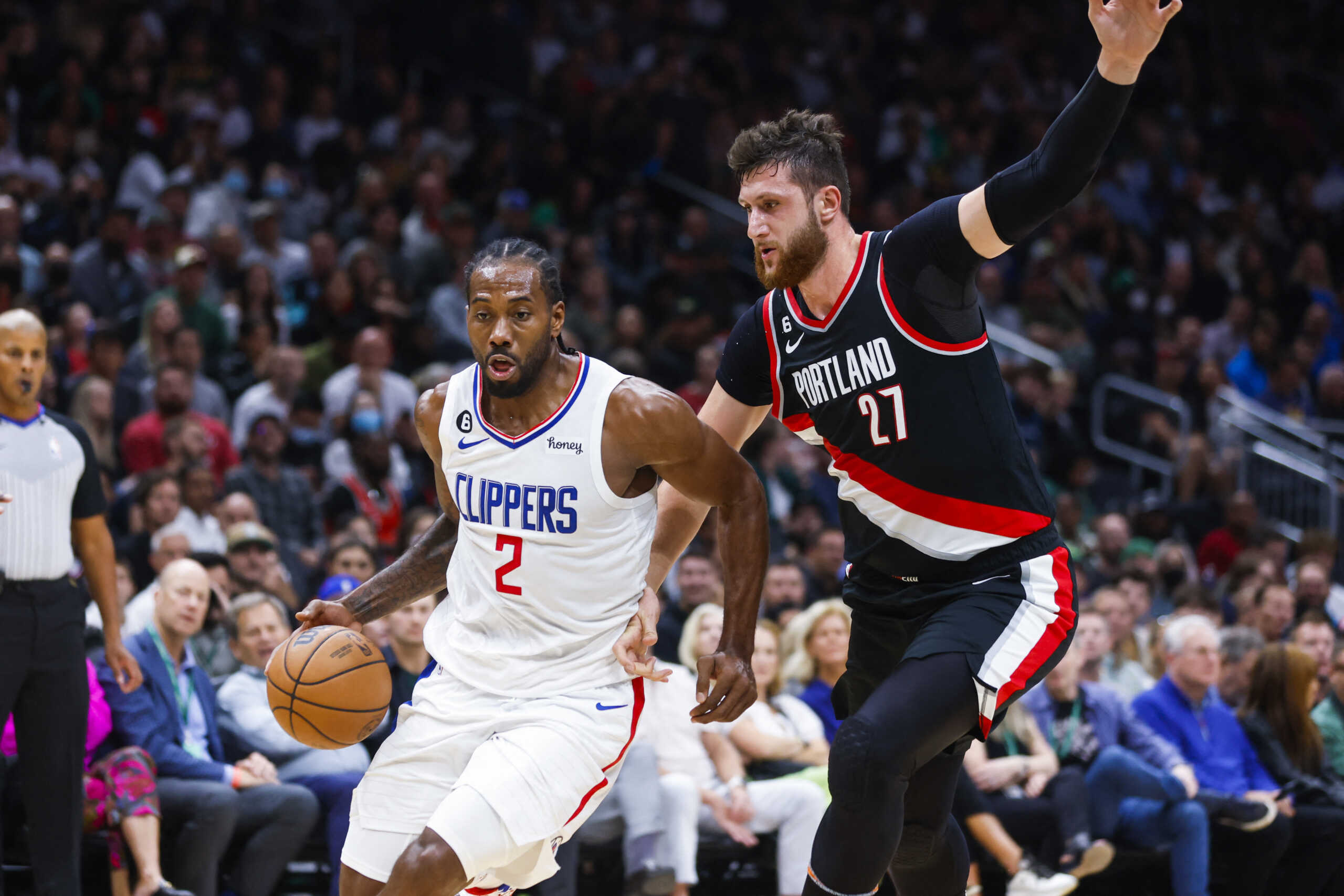 Oct 3, 2022; Seattle, Washington, USA; Los Angeles Clippers forward Kawhi Leonard (2) dribbles past Portland Trail Blazers center Jusuf Nurkic (27) during the second quarter at Climate Pledge Arena. Mandatory Credit: Joe Nicholson-USA TODAY Sports