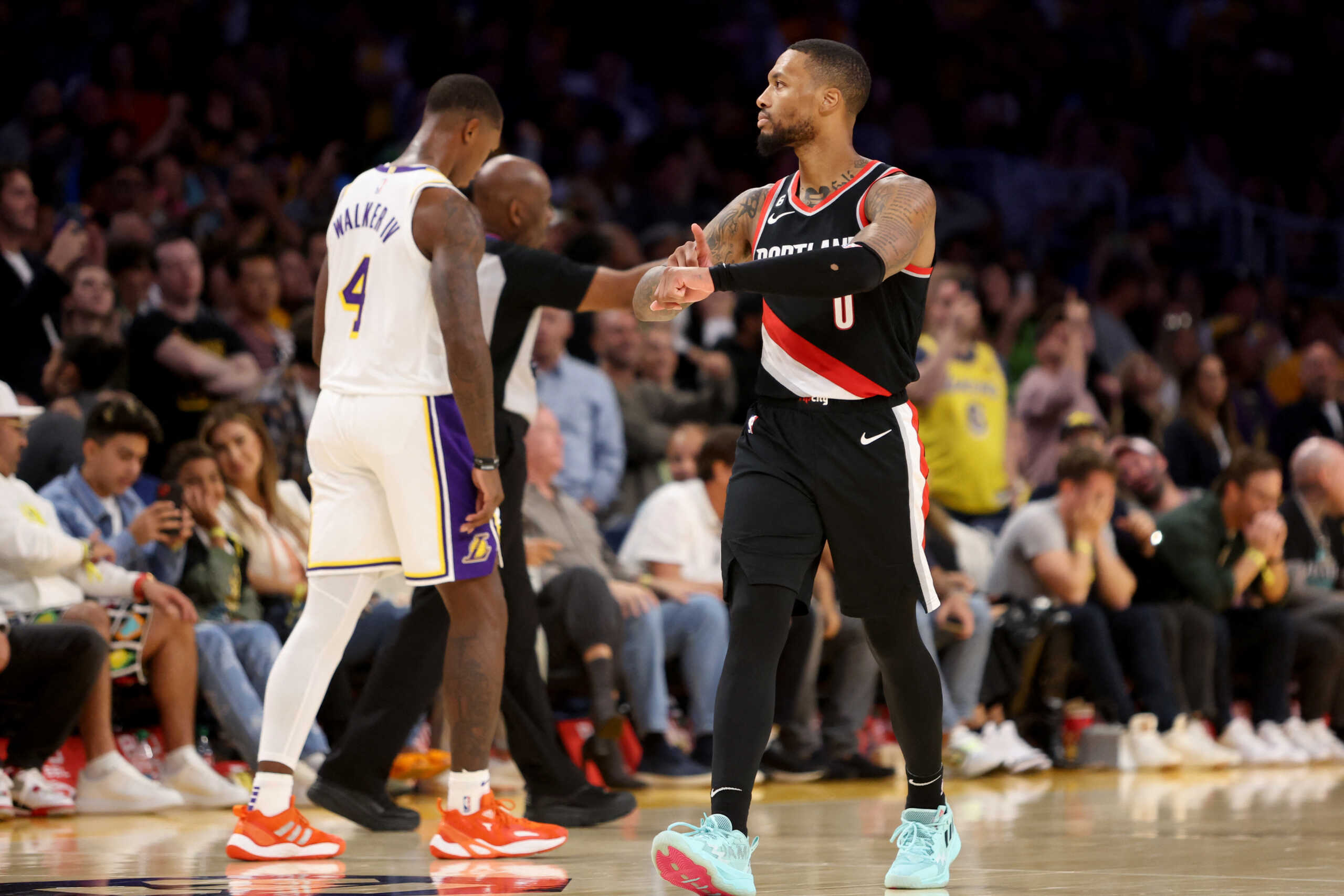 Oct 23, 2022; Los Angeles, California, USA;  Portland Trail Blazers guard Damian Lillard (0) reacts after shooting a three-pointer against the Los Angeles Lakers with 12.4 seconds left in the fourth quarter at Crypto.com Arena. Mandatory Credit: Kiyoshi Mio-USA TODAY Sports