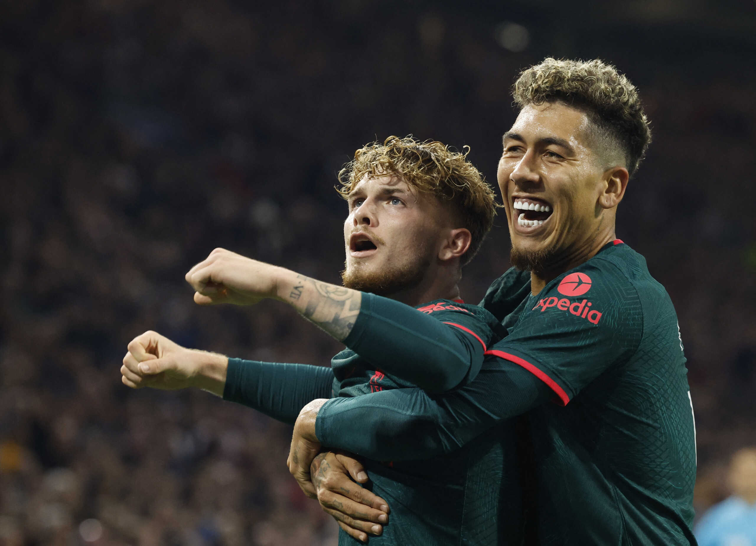 Soccer Football - Champions League - Group A - Ajax Amsterdam v Liverpool - Johan Cruijff Arena, Amsterdam, Netherlands - October 26, 2022 Liverpool's Harvey Elliott celebrates scoring their third goal with Roberto Firmino REUTERS