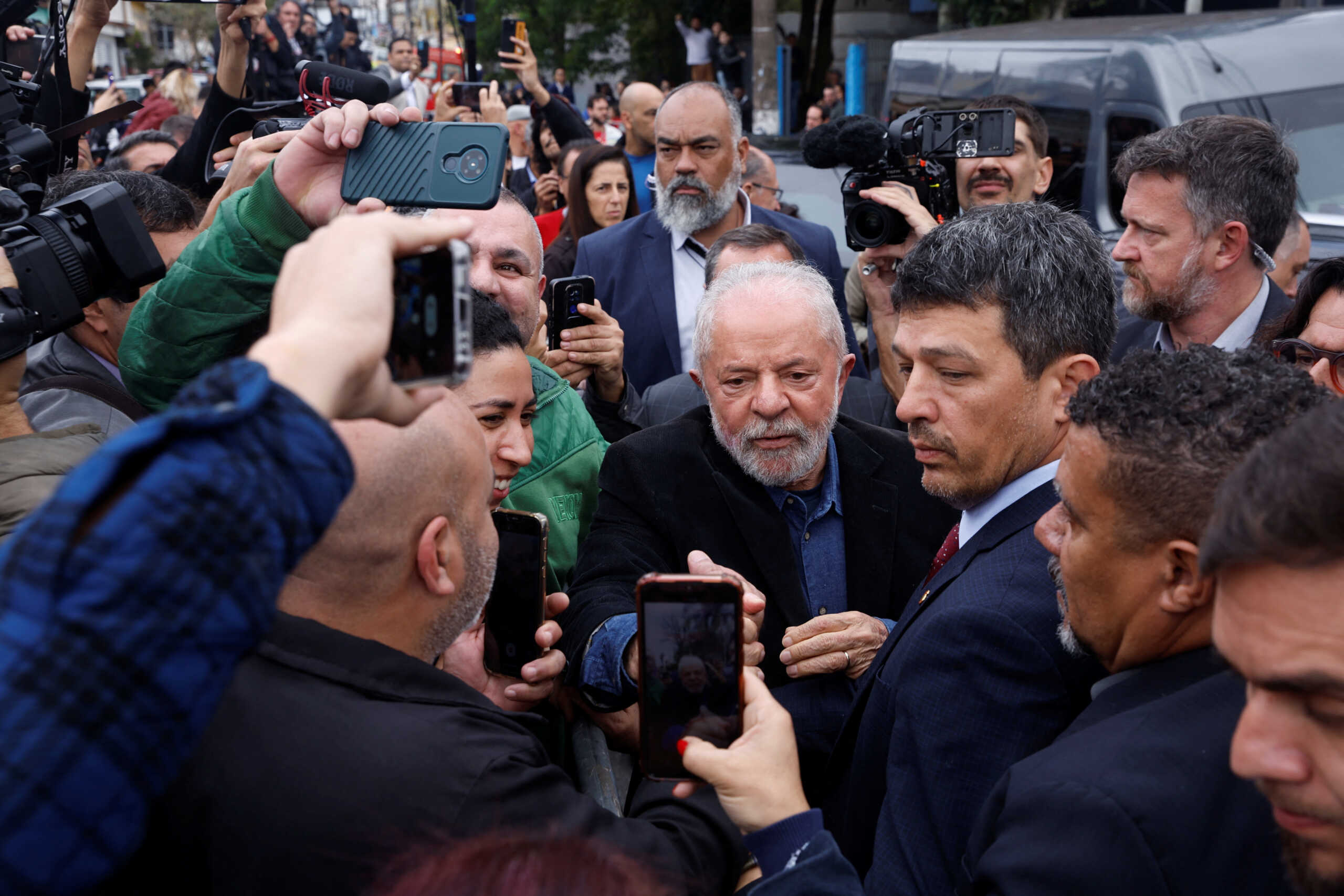 Brazil's former President and presidential candidate Luiz Inacio Lula da Silva greets supporters after casting his vote during the presidential election, in Sao Bernardo do Campo, on the outskirts of Sao Paulo, Brazil October 2, 2022. REUTERS