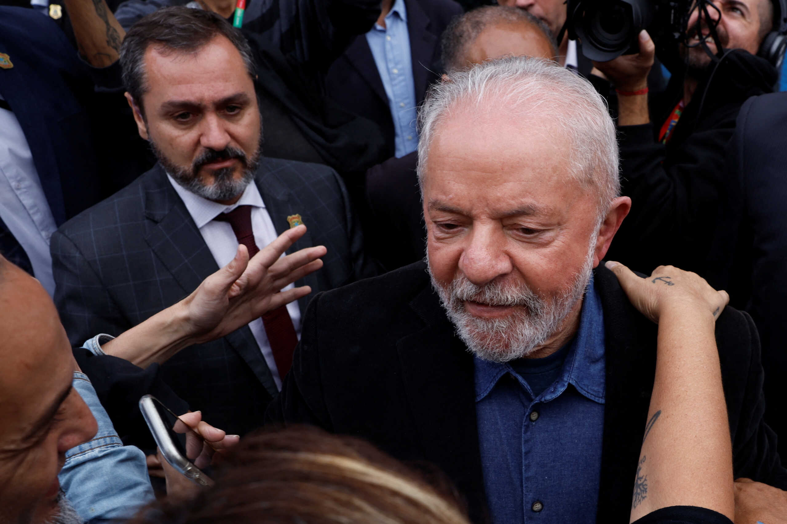 Brazil's former President and presidential candidate Luiz Inacio Lula da Silva greets supporters after casting his vote during the presidential election, in Sao Bernardo do Campo, on the outskirts of Sao Paulo, Brazil October 2, 2022. REUTERS