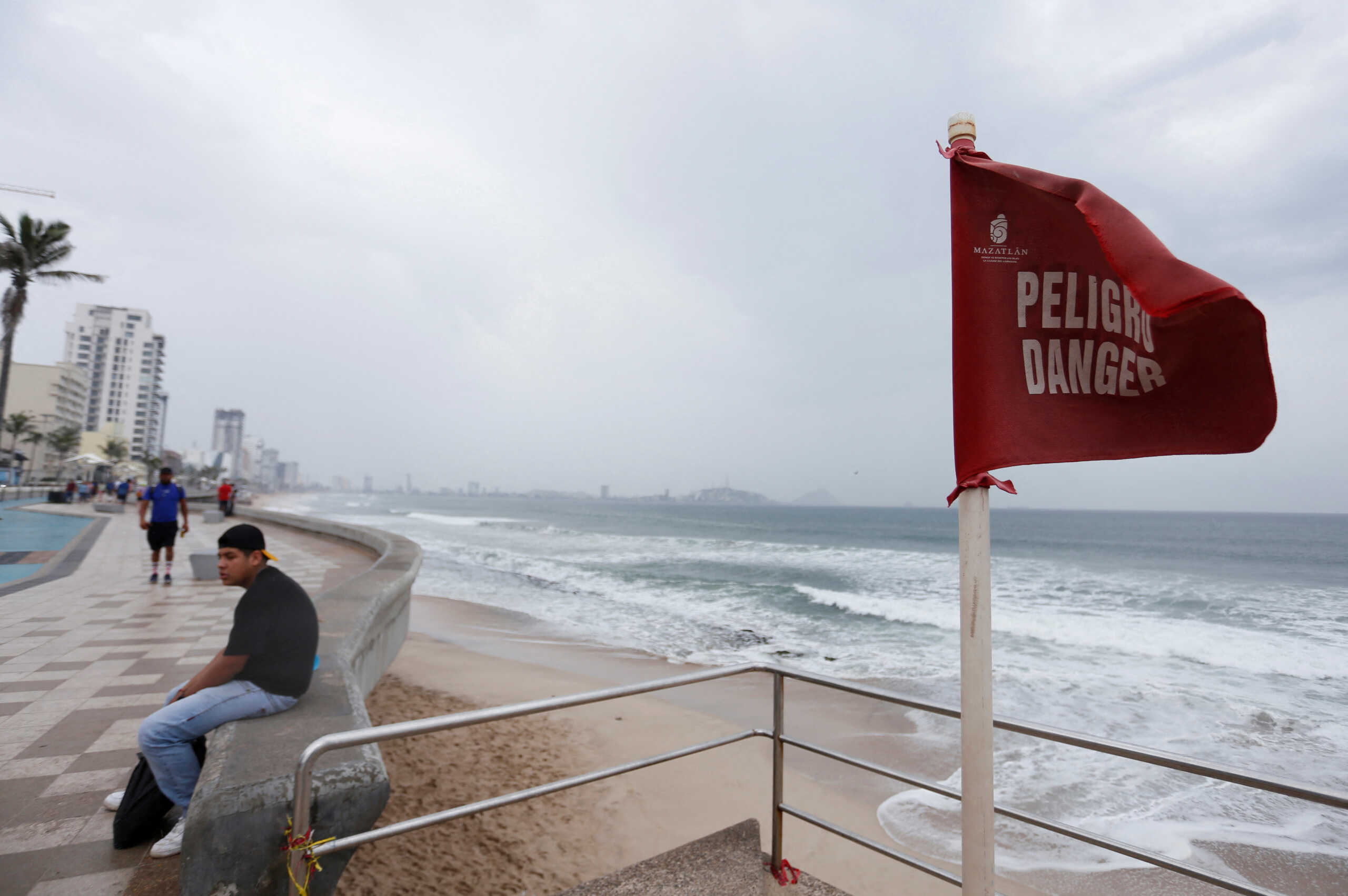 A red flag warns of dangerous conditions at a closed beach on the seafront as Hurricane Orlene approaches the Pacific beach resort of Mazatlan, state of Sinaloa, Mexico October 2, 2022. REUTERS