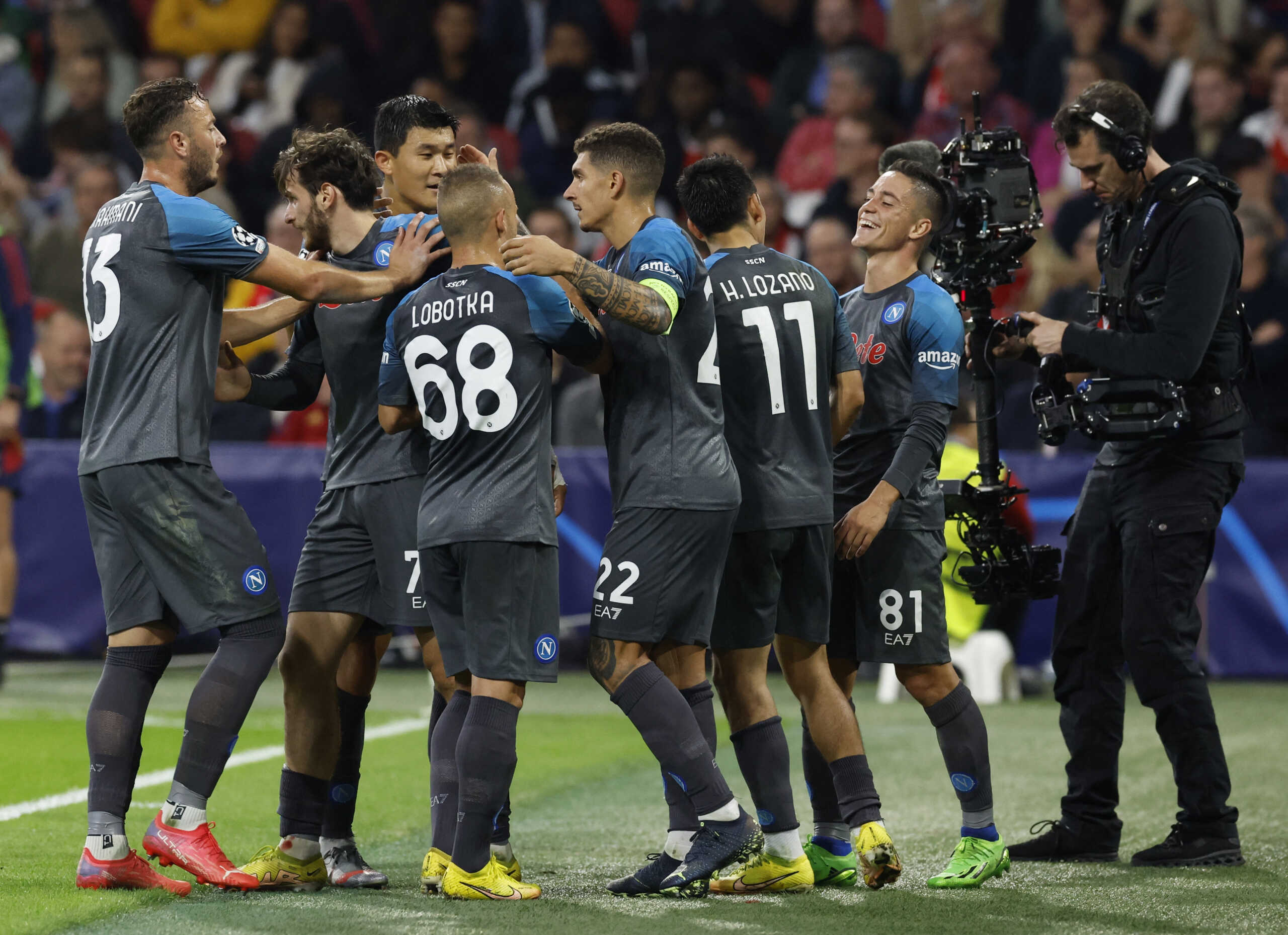 Soccer Football - Champions League - Group A - Ajax Amsterdam v Napoli - Johan Cruijff Arena, Amsterdam, Netherlands - October 4, 2022 Napoli's Khvicha Kvaratskhelia celebrates scoring their fifth goal with teammates REUTERS