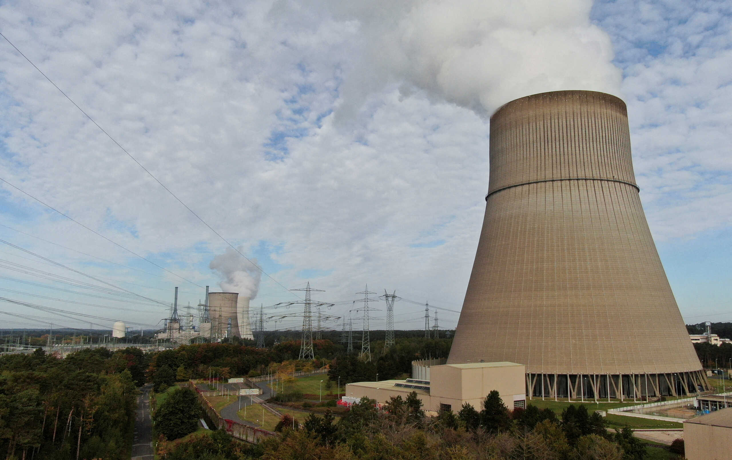 FILE PHOTO: An aerial view shows the cooling tower of Emsland nuclear power plant and in rear the cooling towers of Emsland natural gas power plants of German utility RWE, amid the energy crisis caused by Russia's invasion of Ukraine, on the outskirts of Lingen, Germany, October, 12, 2022. REUTERS