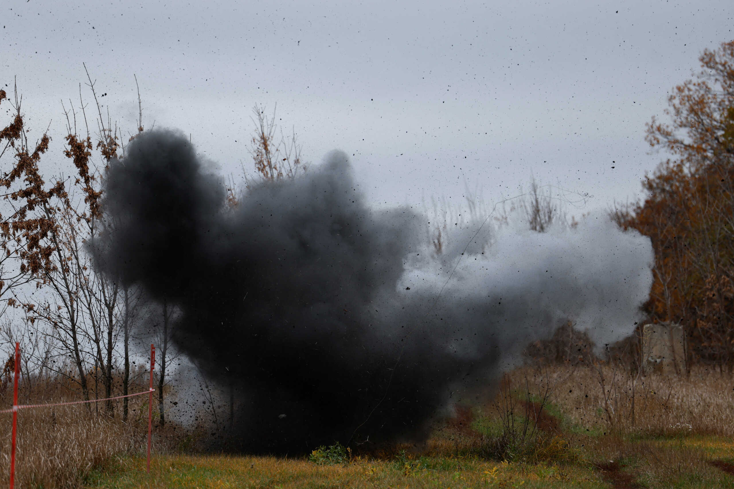 View of a controlled explosion during a mine-clearing demonstration by Ukrainian service members in a field, amid Russia's invasion, in the Kharkiv region of Ukraine October 27, 2022. REUTERS