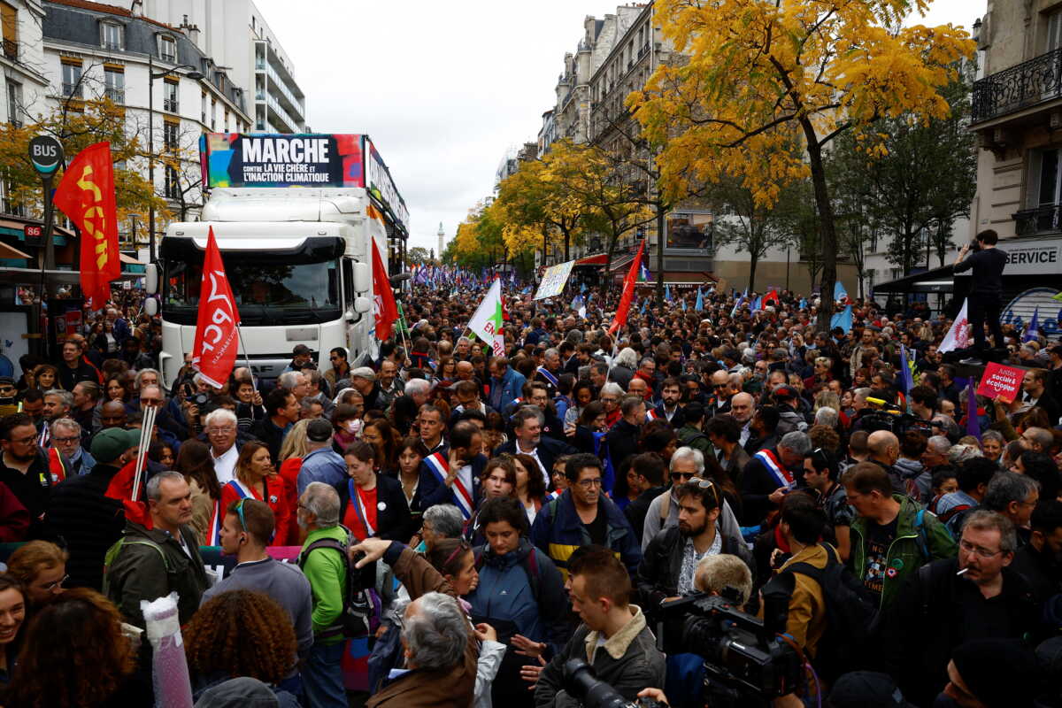 Demonstrators take part in a protest by New Ecologic and Social People's Union (NUPES), a coalition of left and green parties, against soaring inflation and what they call a lack of government action to fight climate change, in Paris, France October 16, 2022. REUTERS