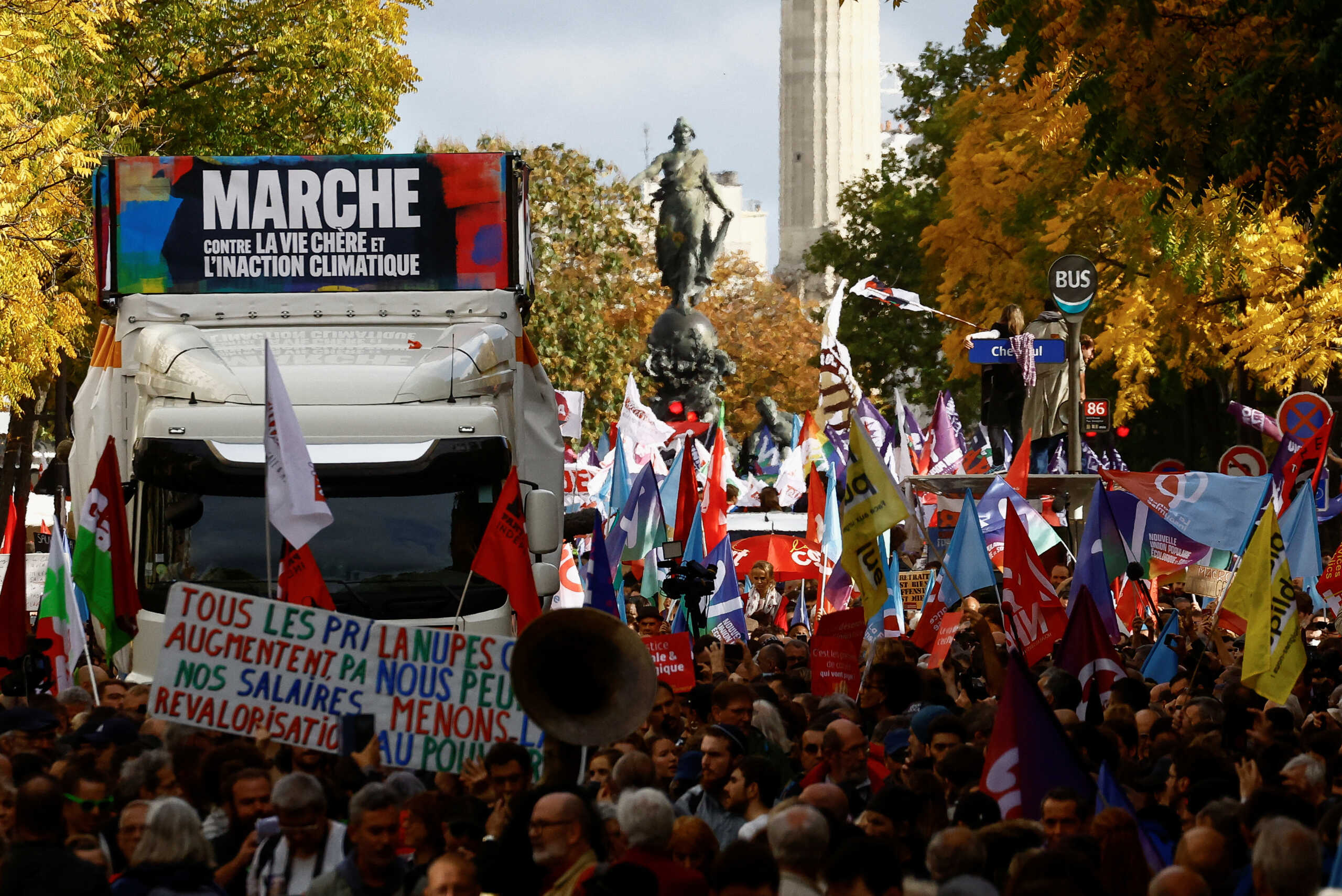 Demonstrators take part in a protest by New Ecologic and Social People's Union (NUPES), a coalition of left and green parties, against soaring inflation and what they call a lack of government action to fight climate change, in Paris, France October 16, 2022. REUTERS
