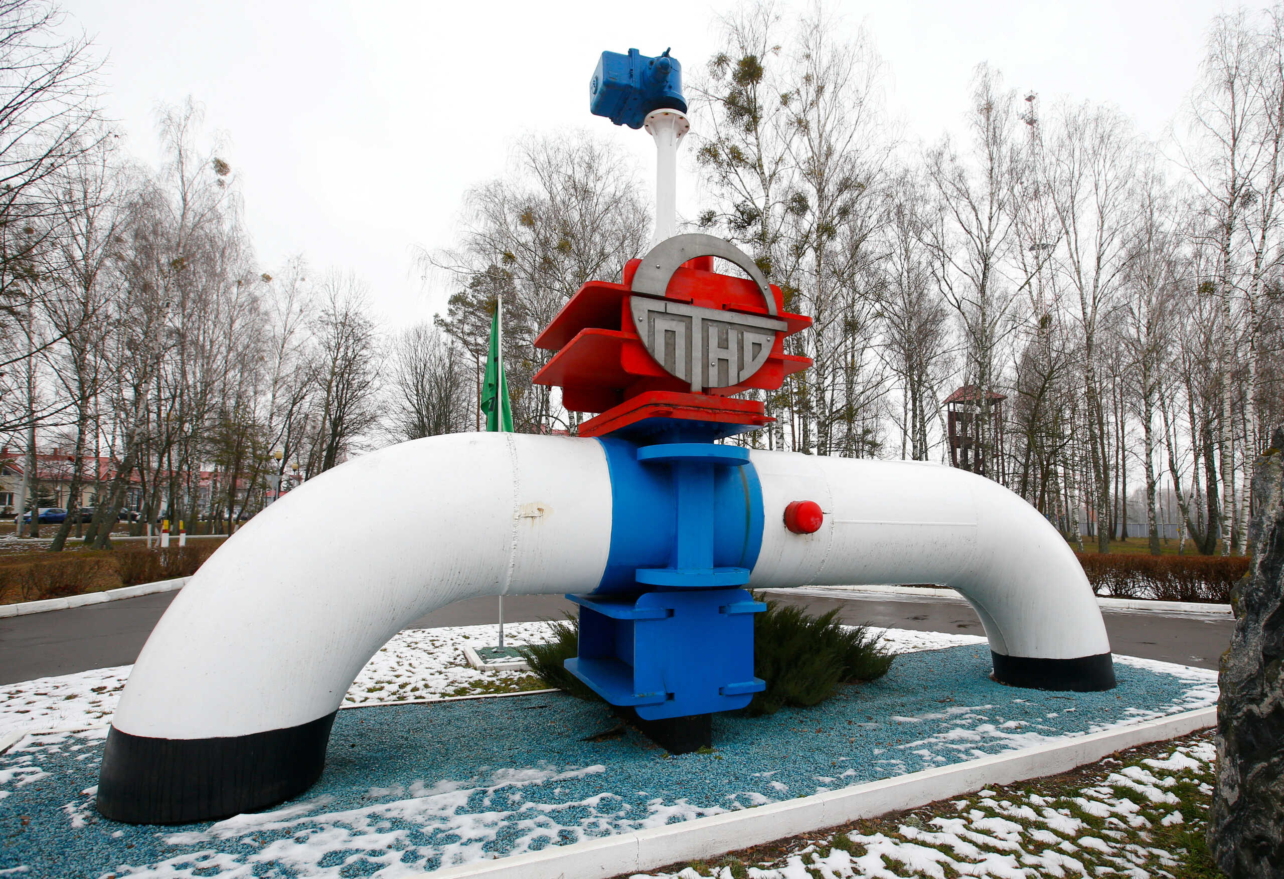 FILE PHOTO: A model of a pipe line is seen at the main entrance to the Gomel Transneft oil pumping station, which moves crude through the Northern Druzhba pipeline westwards to Poland and Europe, near Mozyr, Belarus, in this file picture taken January 4, 2020.  REUTERS