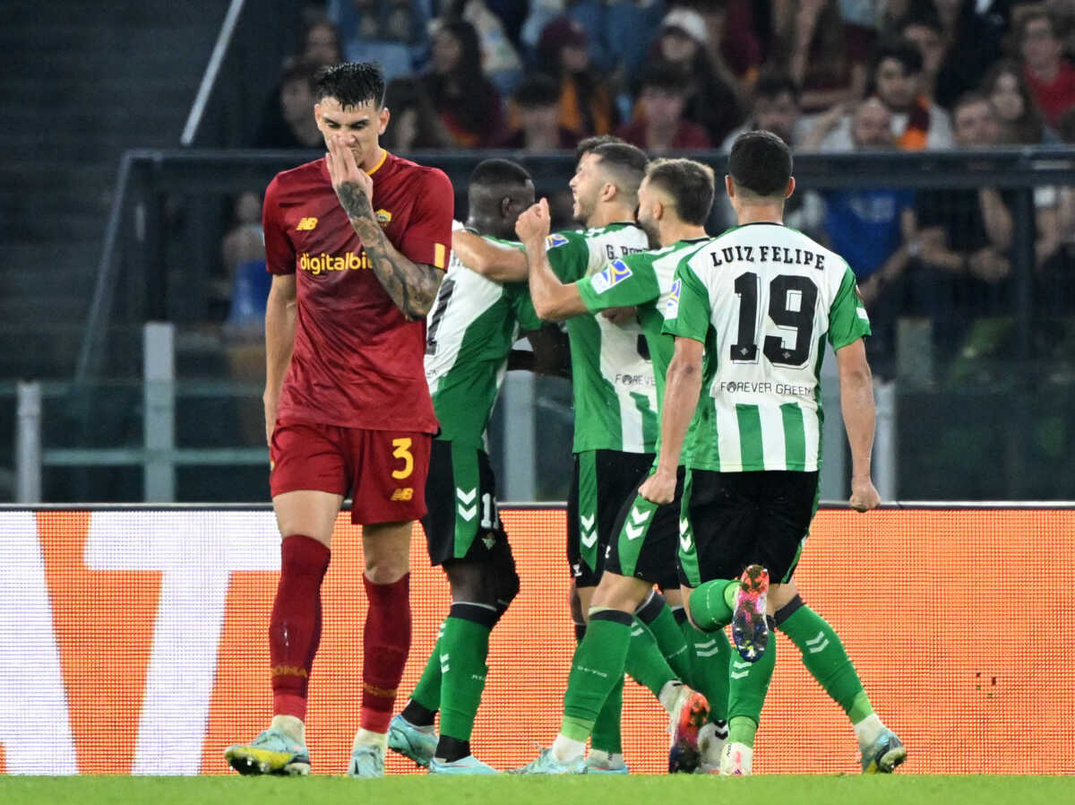 Soccer Football - Europa League - Group C - AS Roma v Real Betis - Stadio Olimpico, Rome, Italy - October 6, 2022  Real Betis' Luiz Henrique celebrates scoring their second goal with teammates and AS Roma's Roger Ibanez looks dejected REUTERS