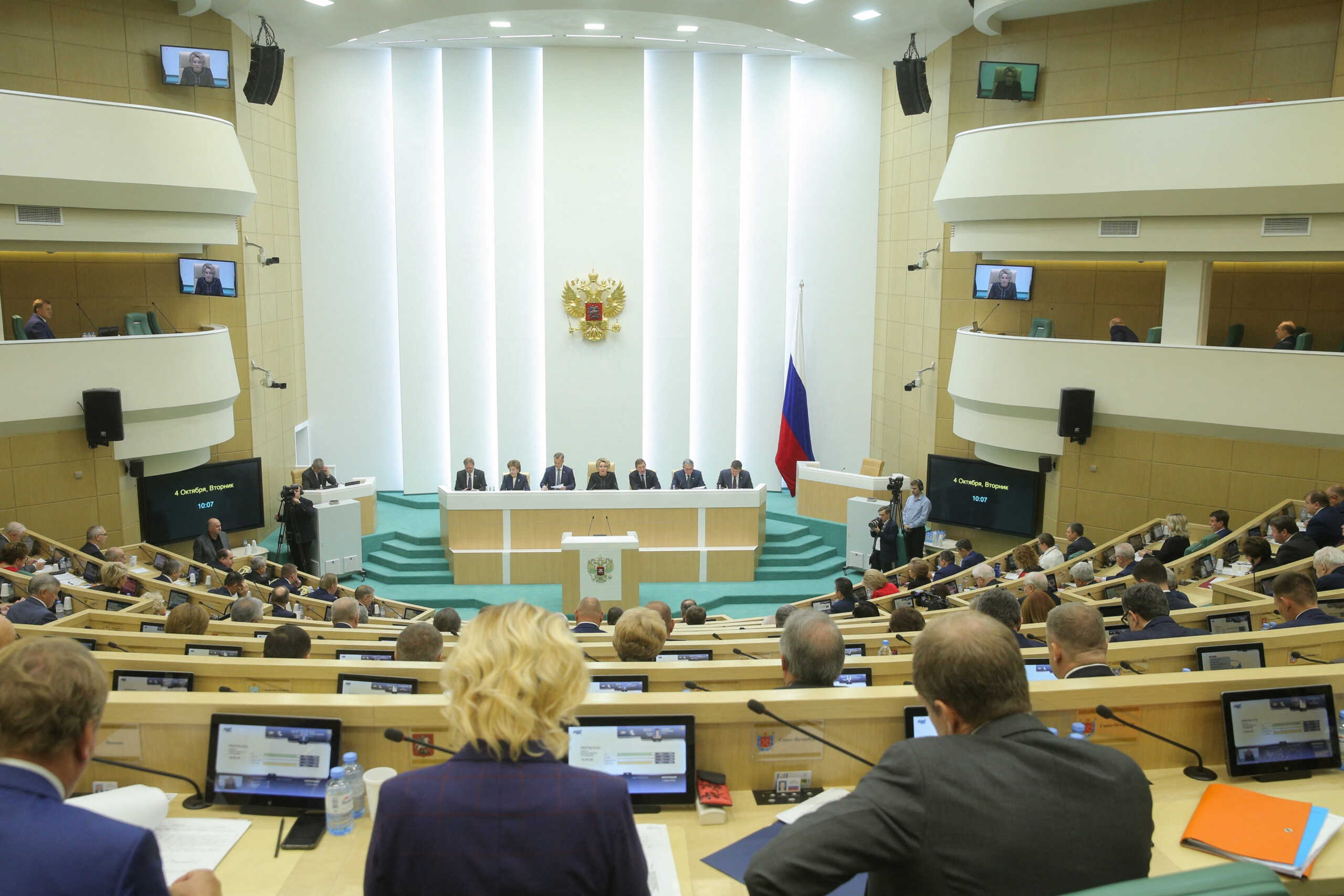 Members of the Russia's Federation Council, the upper house of parliament, attend a session to ratify legislation on annexing Ukraine's Donetsk, Kherson, Luhansk and Zaporizhzhia regions into Russia, in Moscow, Russia October 4, 2022. Russian Federation Council