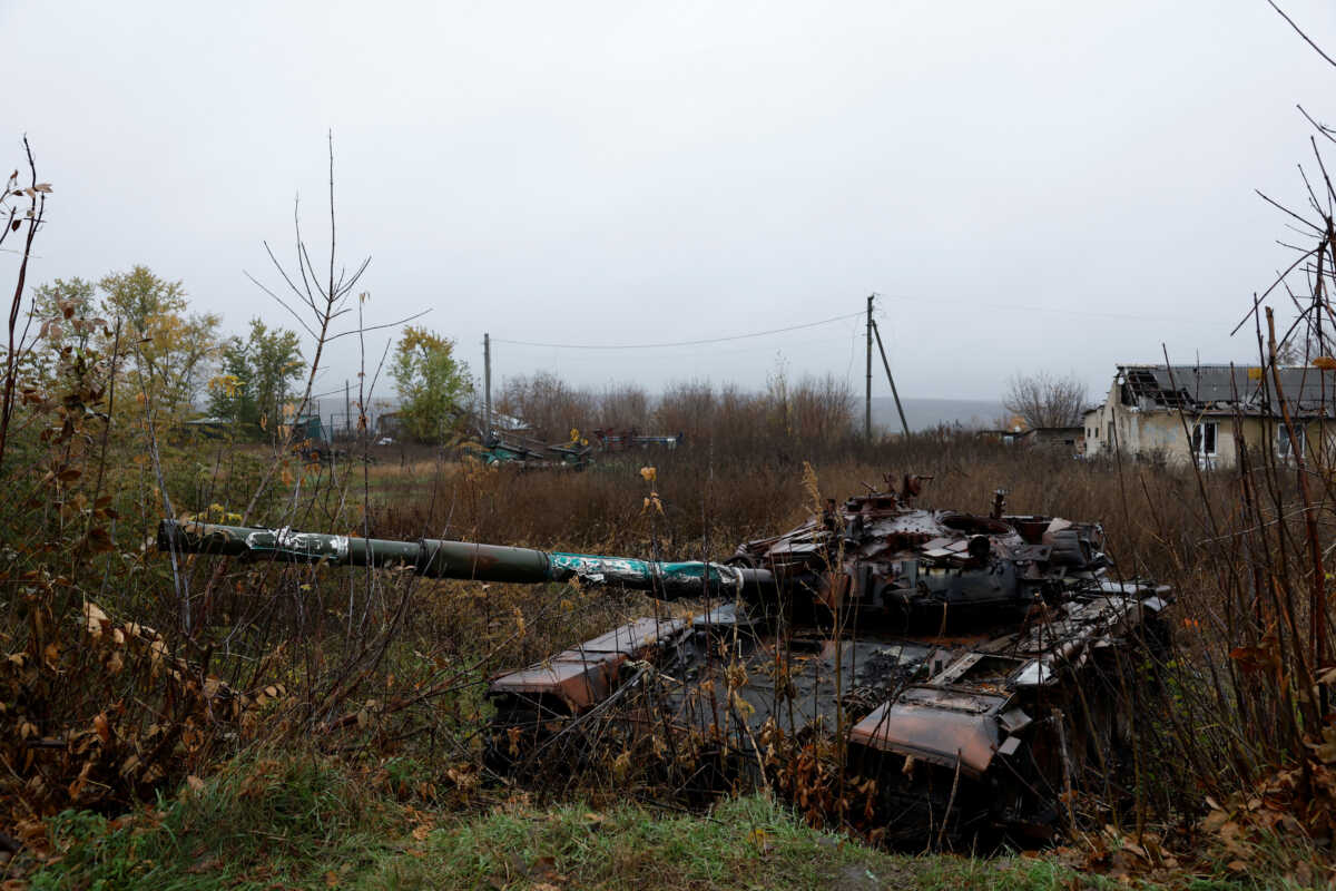 A destroyed tank is seen in the village where Myhaylo Yurkiv, 65, stayed in a bunker for six months during fierce battles under Russian occupation which destroyed his home and cut the village in two by the shelling of the bridge, leaving him now as the only person living on his side of the village, as Russia's invasion of Ukraine continues, in Tsupivka, Ukraine, October 26, 2022. REUTERS