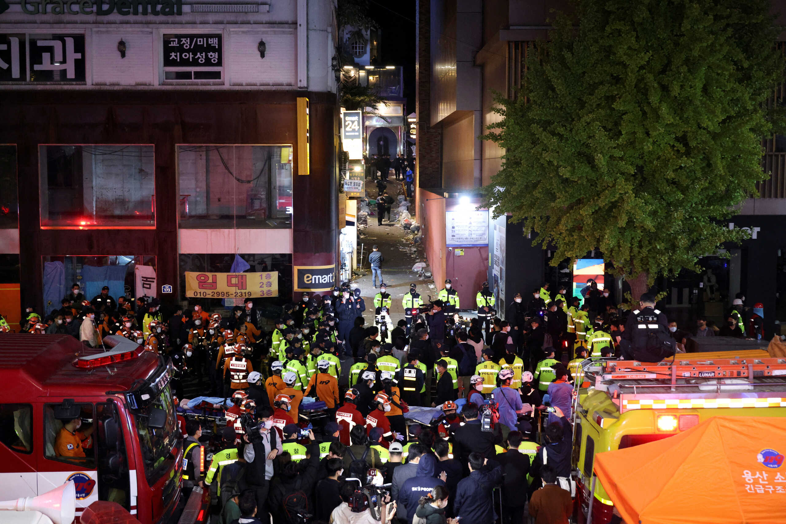 Rescue team and firefighters work at the scene where dozens of people were injured in a stampede during a Halloween festival in Seoul, South Korea, October 29, 2022. REUTERS