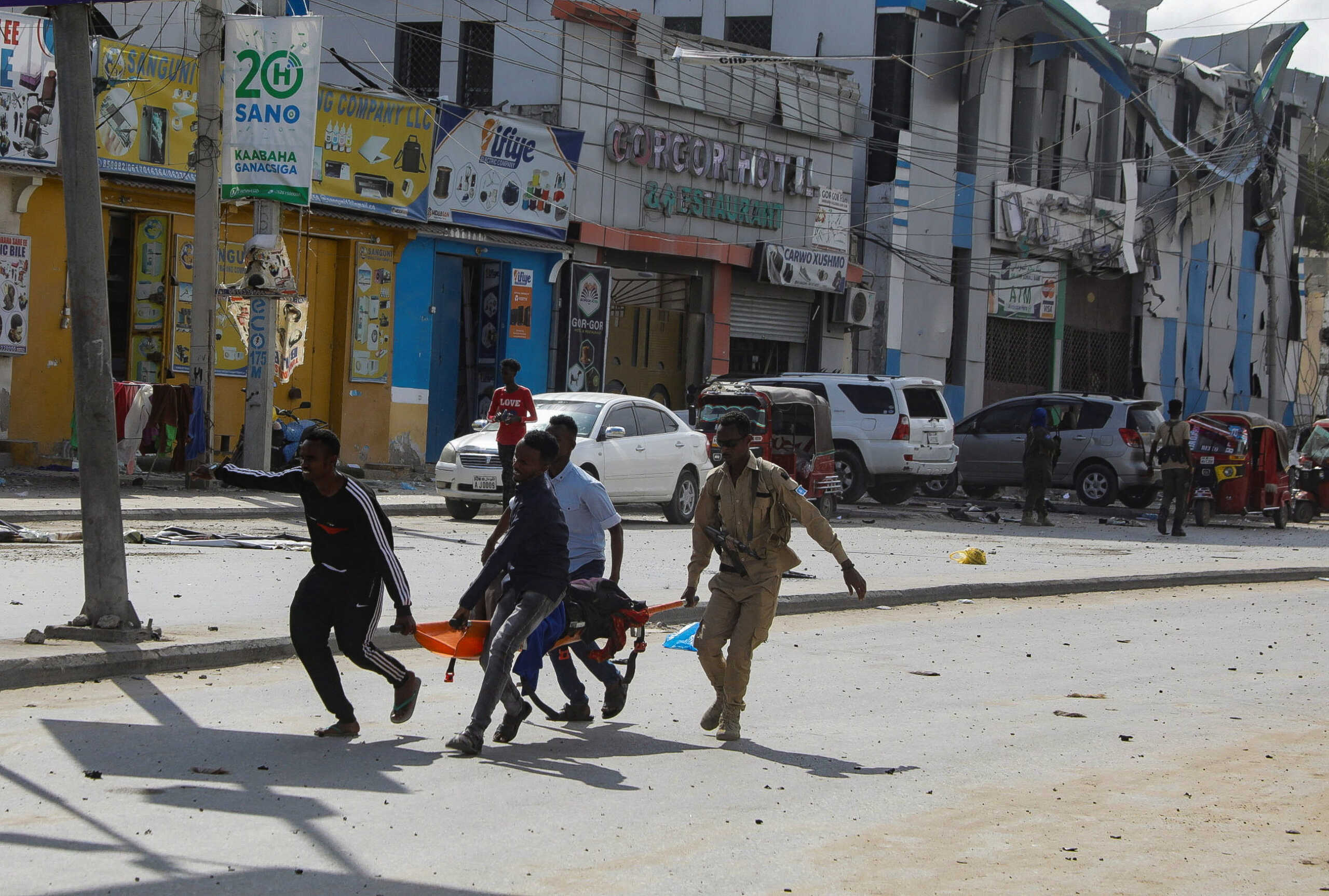 An injured civilian is evacuated from the scene of an explosion near the education ministry building along K5 street in Mogadishu, Somalia October 29, 2022. REUTERS
