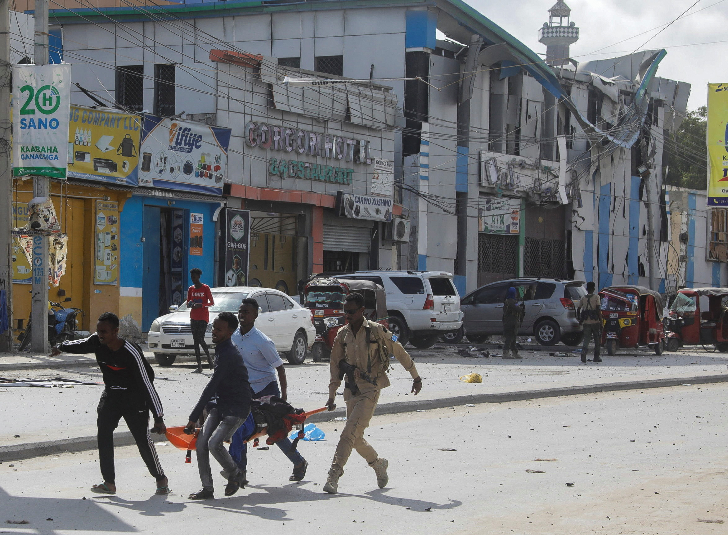 An injured civilian is evacuated from the scene of an explosion near the education ministry building along K5 street in Mogadishu, Somalia October 29, 2022. REUTERS