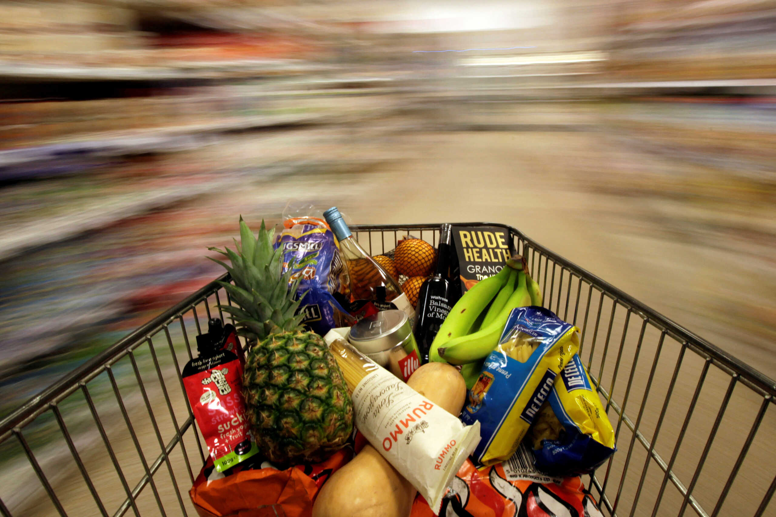 FILE PHOTO: A shopping trolley is pushed around a supermarket in London, Britain May 19, 2015. REUTERS