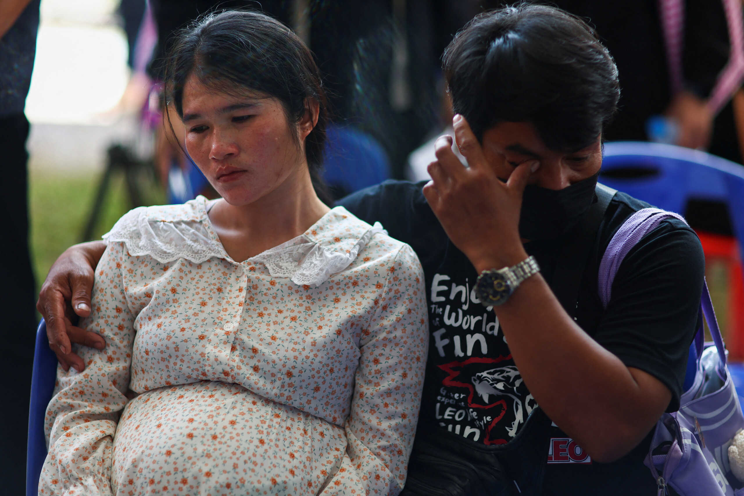 Parents of a victim react as they gather outside the day care centre which was the scene of a mass shooting, in the town of Uthai Sawan, around 500 km northeast of Bangkok, in the province of Nong Bua Lam Phu, Thailand October 7, 2022. REUTERS