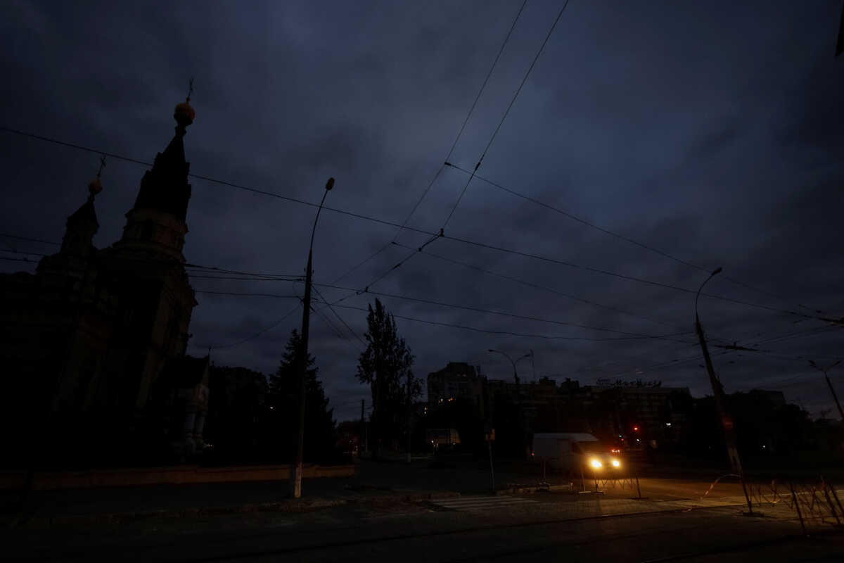A van moves along a dark street during electricity shortage, amid Russia's attack on Ukraine, in Mykolaiv, Ukraine October 20, 2022.  REUTERS