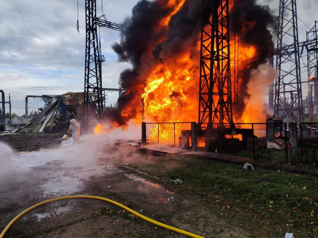 Firefighters work to put out a fire at energy infrastructure facilities, damaged by a Russian missile strike, as Russia's attack on Ukraine continues, in an undisclosed location, Ukraine October 22, 2022.  Ukrainian Presidential Press Service