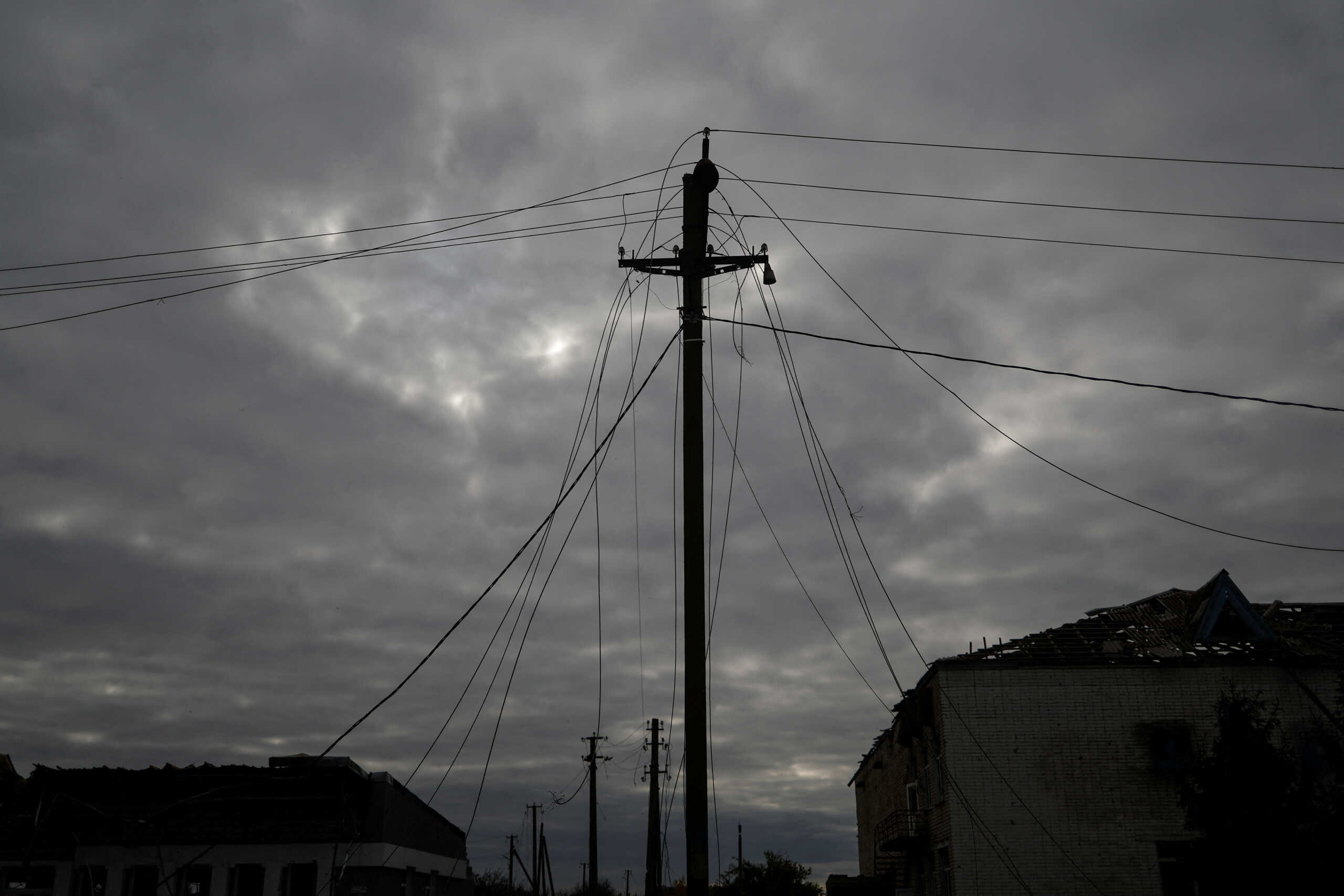 Wires of an electric power line damaged by Russian military strikes are seen in a village near a frontline in Mykolaiv region, Ukraine October 28, 2022.  REUTERS