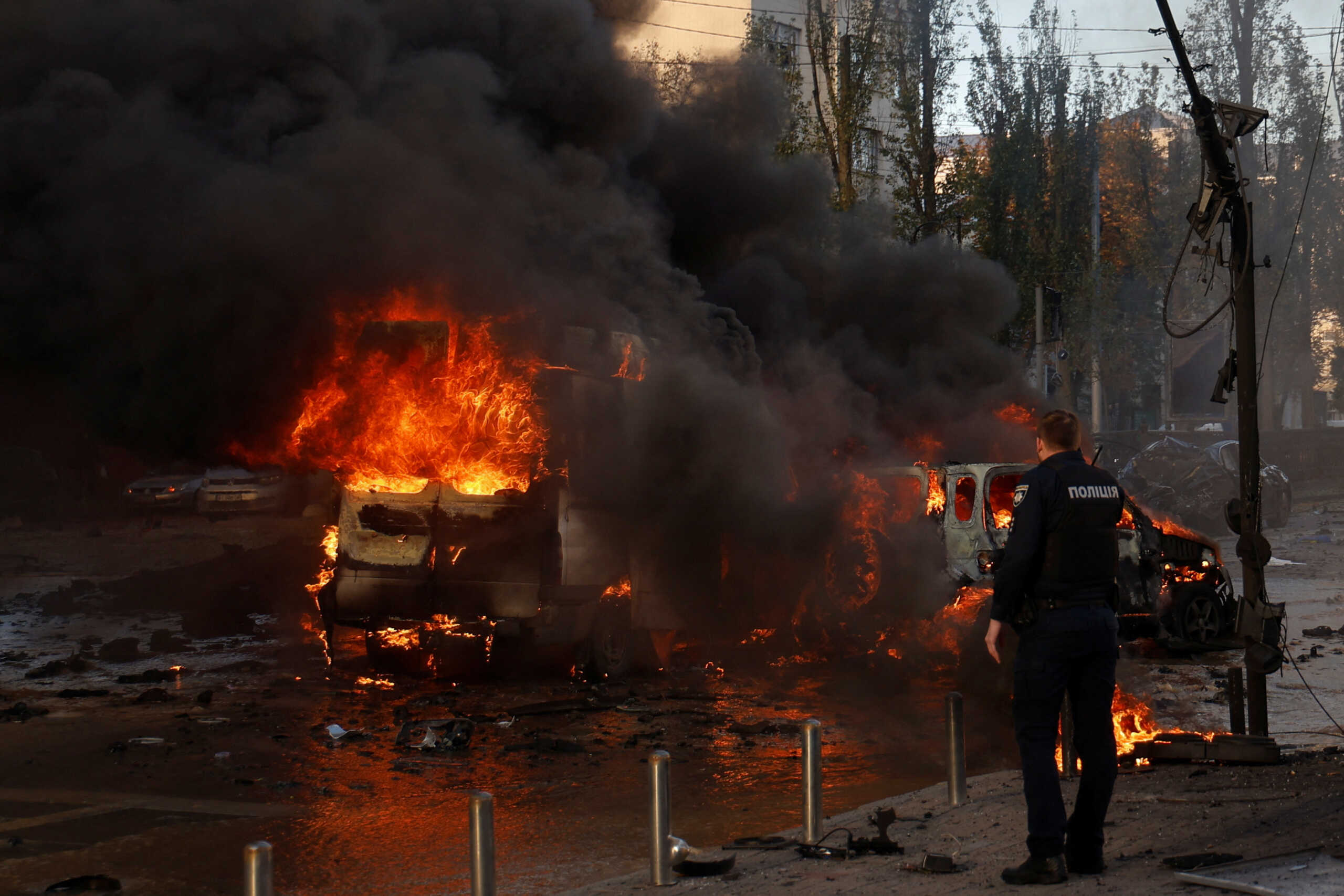 Cars are on fire after Russia's missile attack in Kyiv, Ukraine October 10, 2022. REUTERS
