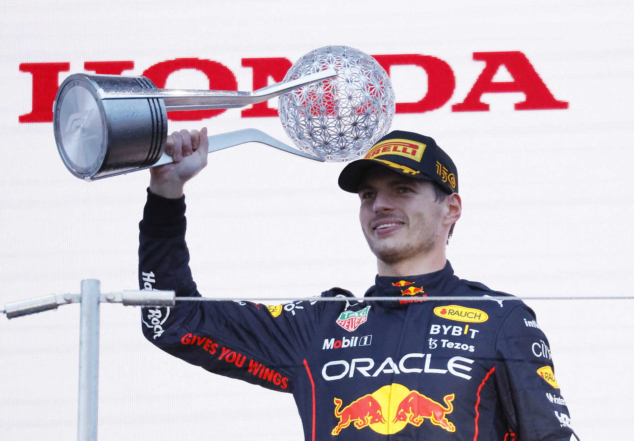 Formula One F1 - Japanese Grand Prix - Suzuka Circuit, Suzuka, Japan - October 9, 2022 Red Bull's Max Verstappen celebrates winning the race and the championship on the podium REUTERS