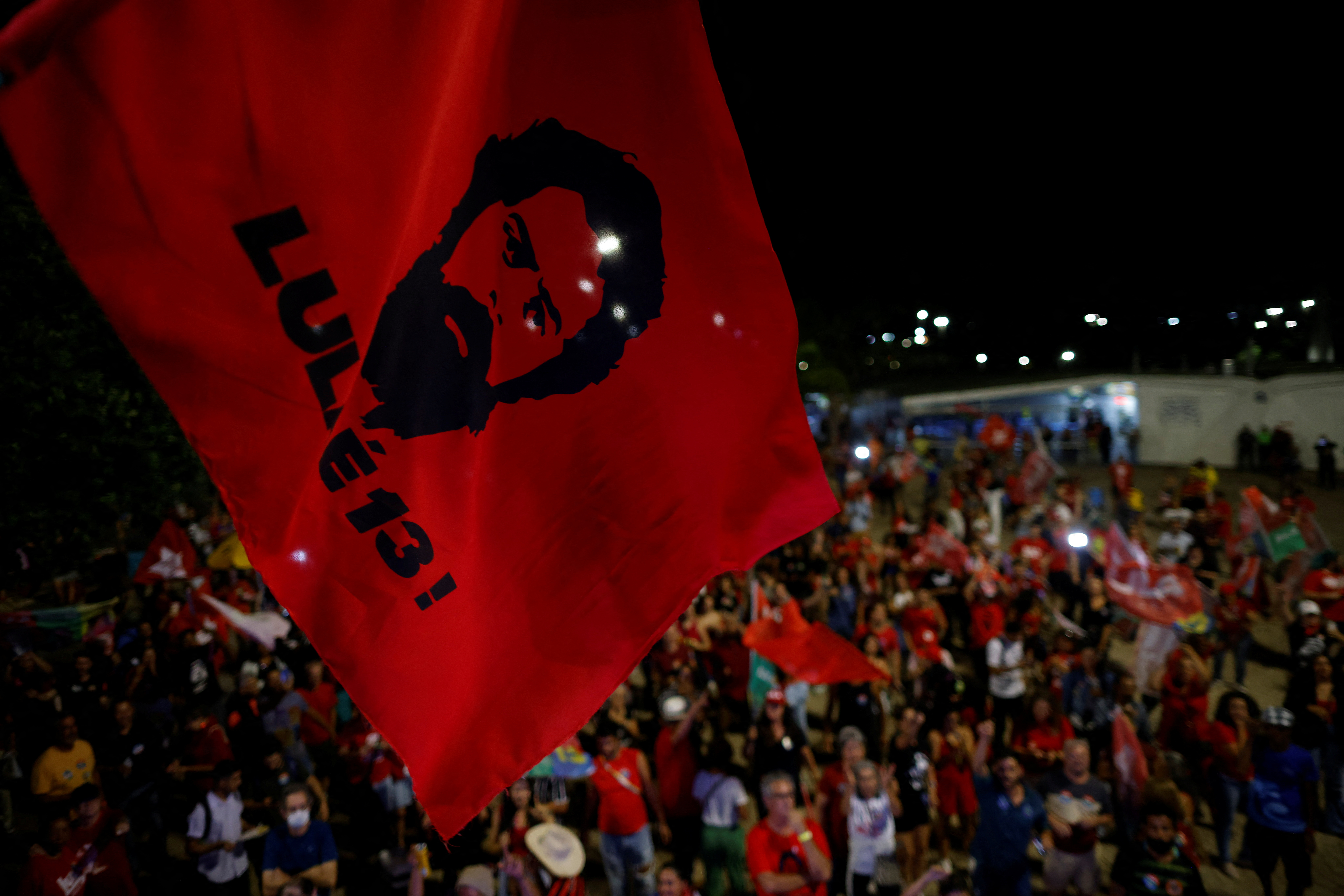 Supporter of former Brazilian President and presidential candidate Luiz Inacio Lula da Silva react after polls were closed in Brazil's presidential election, in Brasilia, Brazil October 2, 2022. REUTERS
