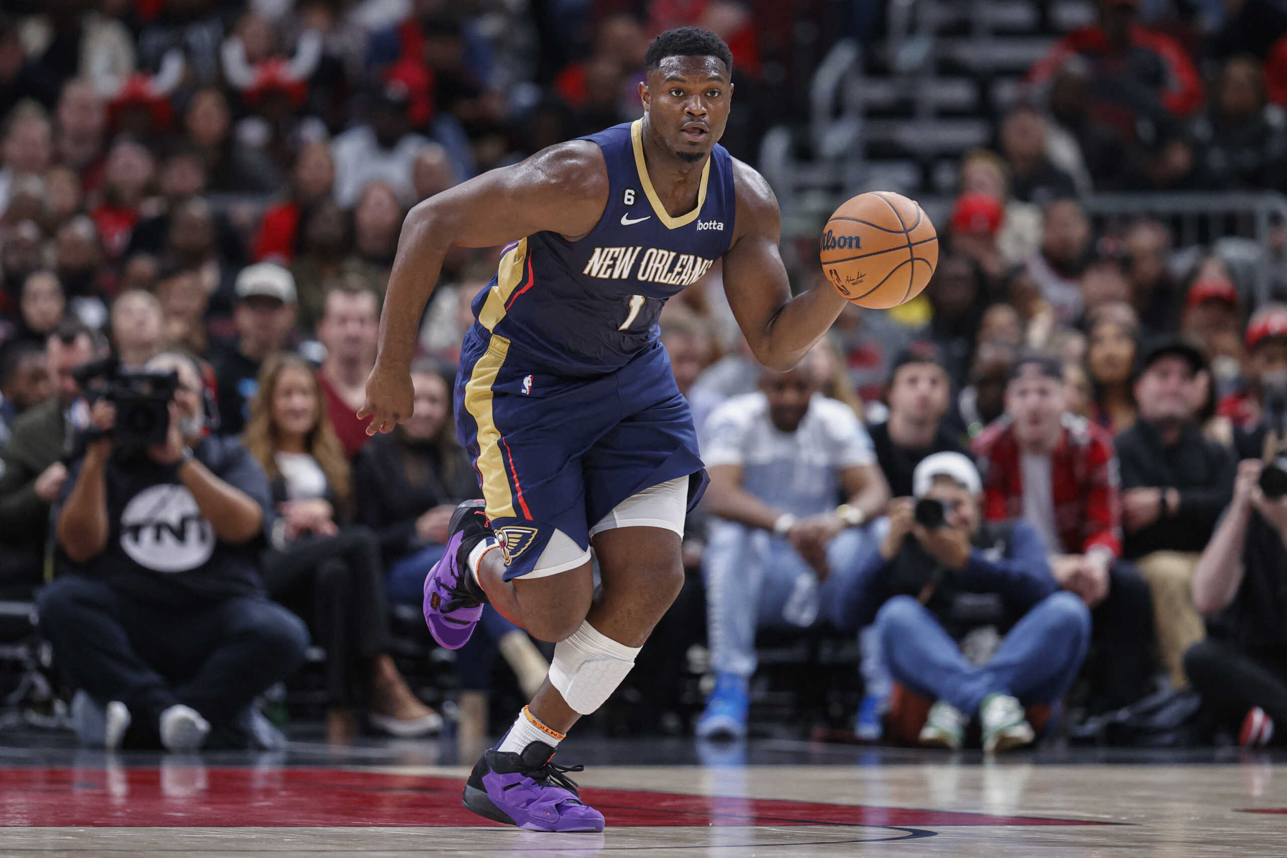 Oct 4, 2022; Chicago, Illinois, USA; New Orleans Pelicans forward Zion Williamson (1) brings the ball up court against the Chicago Bulls during the first half of a preseason NBA basketball game at United Center. Mandatory Credit: Kamil Krzaczynski-USA TODAY Sports