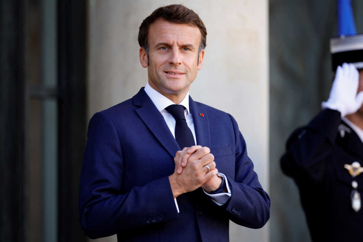 French President Emmanuel Macron waits for the arrival of German Chancellor Olaf Scholz (not seen) for a meeting at the Elysee Palace in Paris, France, October 26, 2022.  REUTERS
