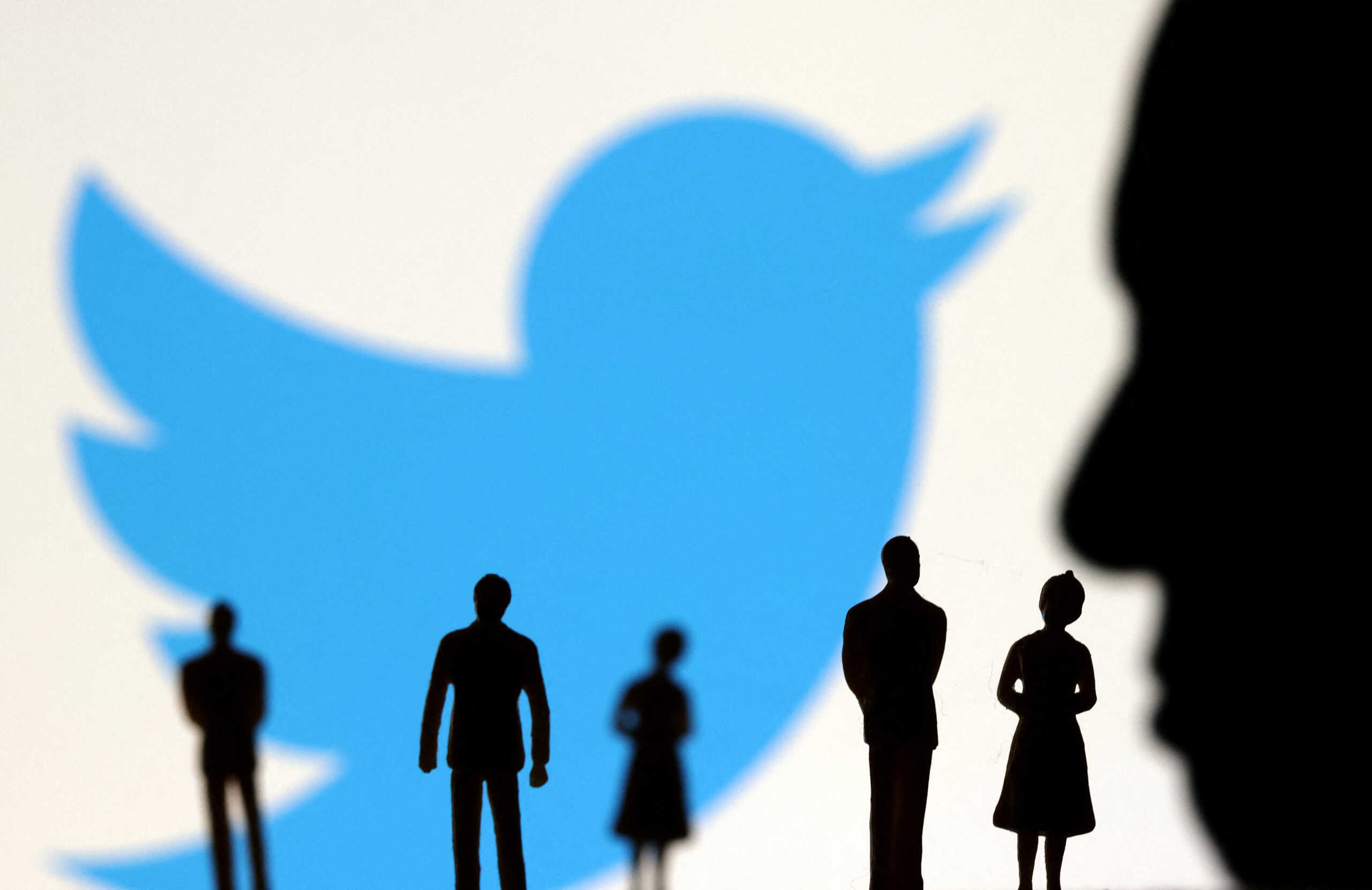 Elon Musk photo, small figurines and Twitter logo are seen in this illustration taken November 4, 2022. REUTERS