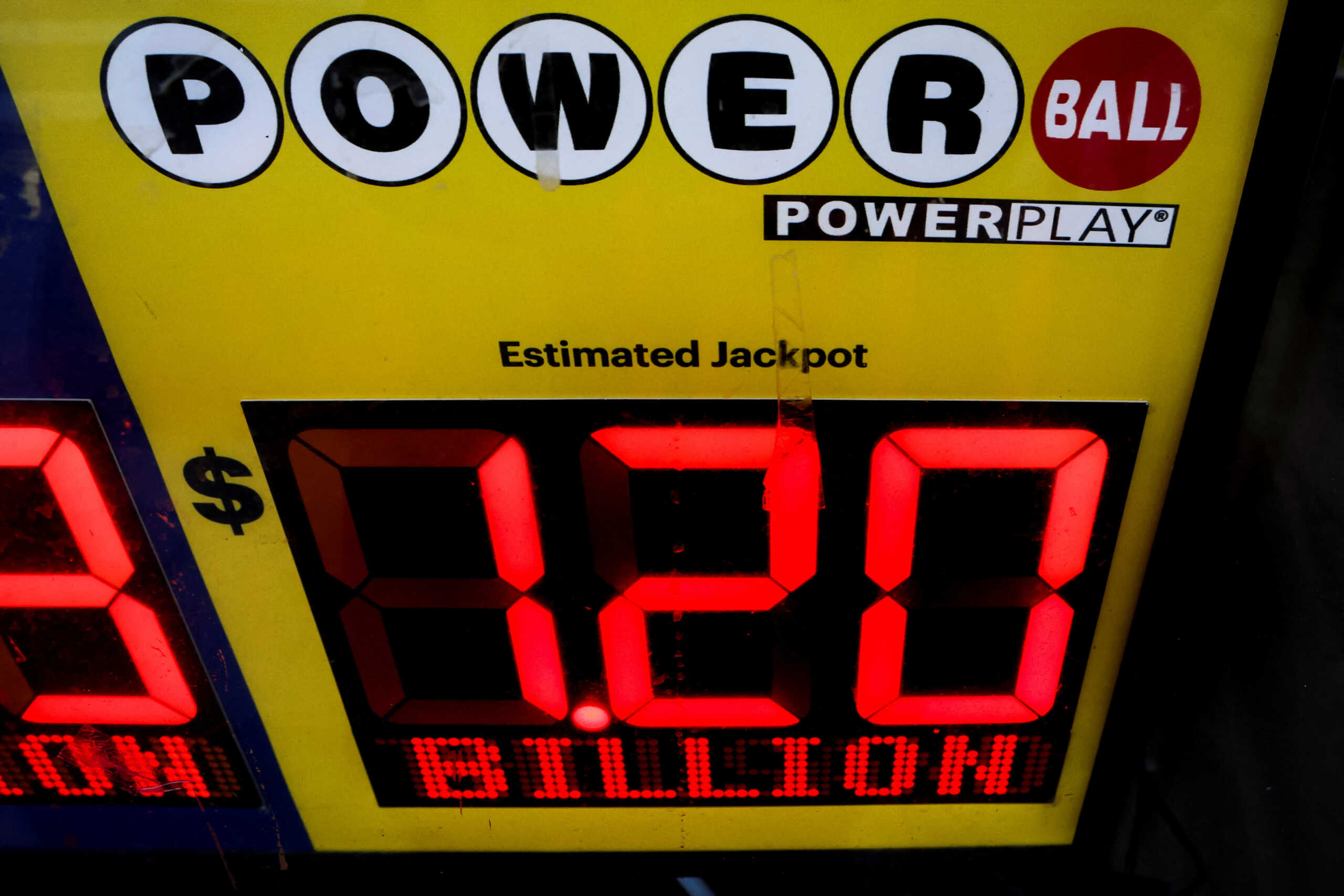 A screen advertises the Powerball jackpot of $1.2 billion dollars in a store in Brooklyn, New York, U.S., November 2, 2022. REUTERS