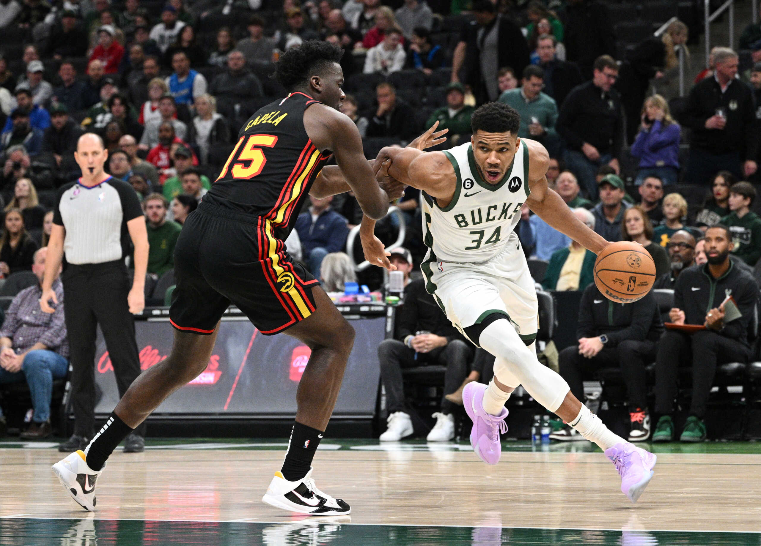 Nov 14, 2022; Milwaukee, Wisconsin, USA; Milwaukee Bucks forward Giannis Antetokounmpo (34) drives to the basket against Atlanta Hawks center Clint Capela (15) in the first quarter at Fiserv Forum. Mandatory Credit: Michael McLoone-USA TODAY Sports