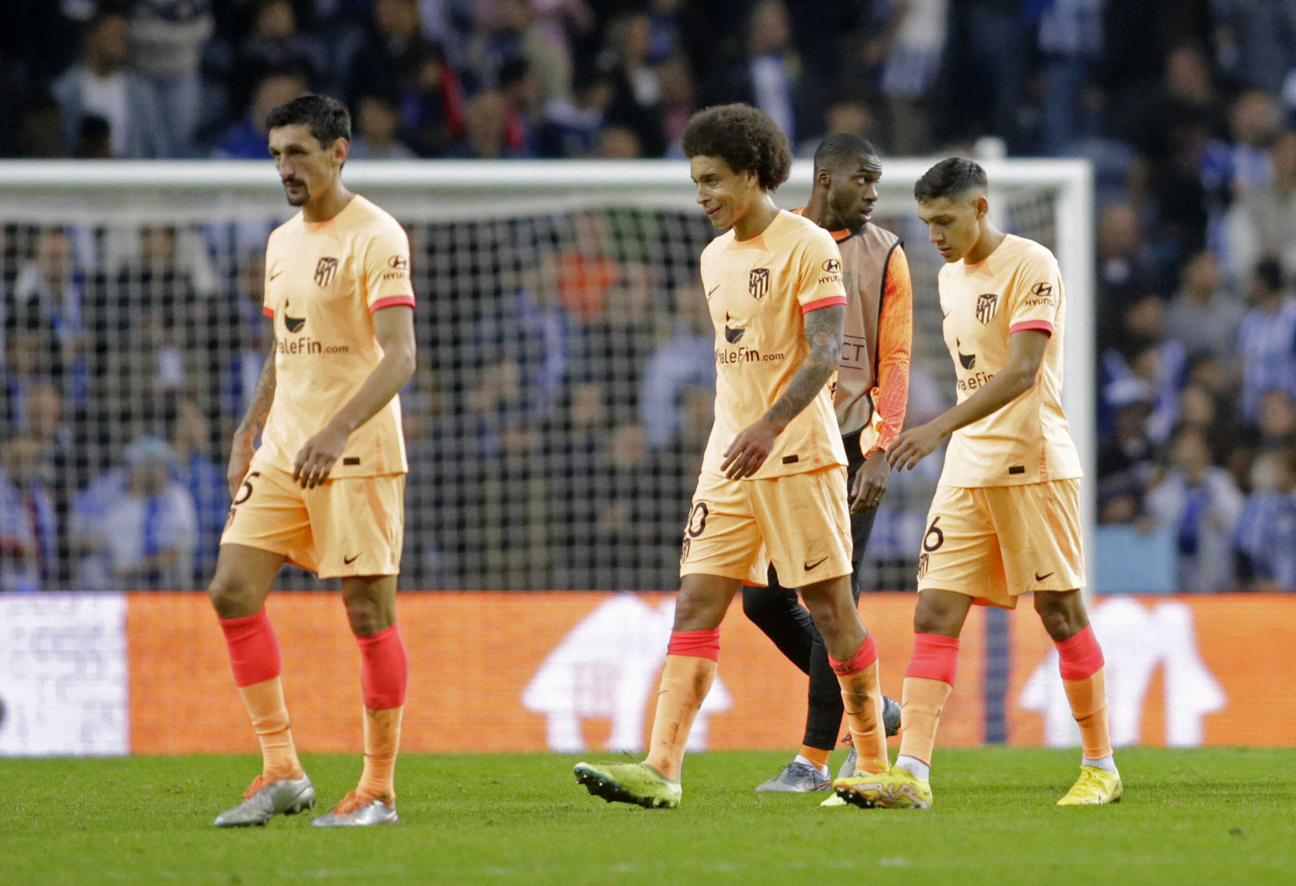 Soccer Football - Champions League - Group B - FC Porto v Atletico Madrid - Estadio do Dragao, Porto, Portugal - November 1, 2022 Atletico Madrid's Stefan Savic, Axel Witsel and Nahuel Molina look dejected after the match REUTERS