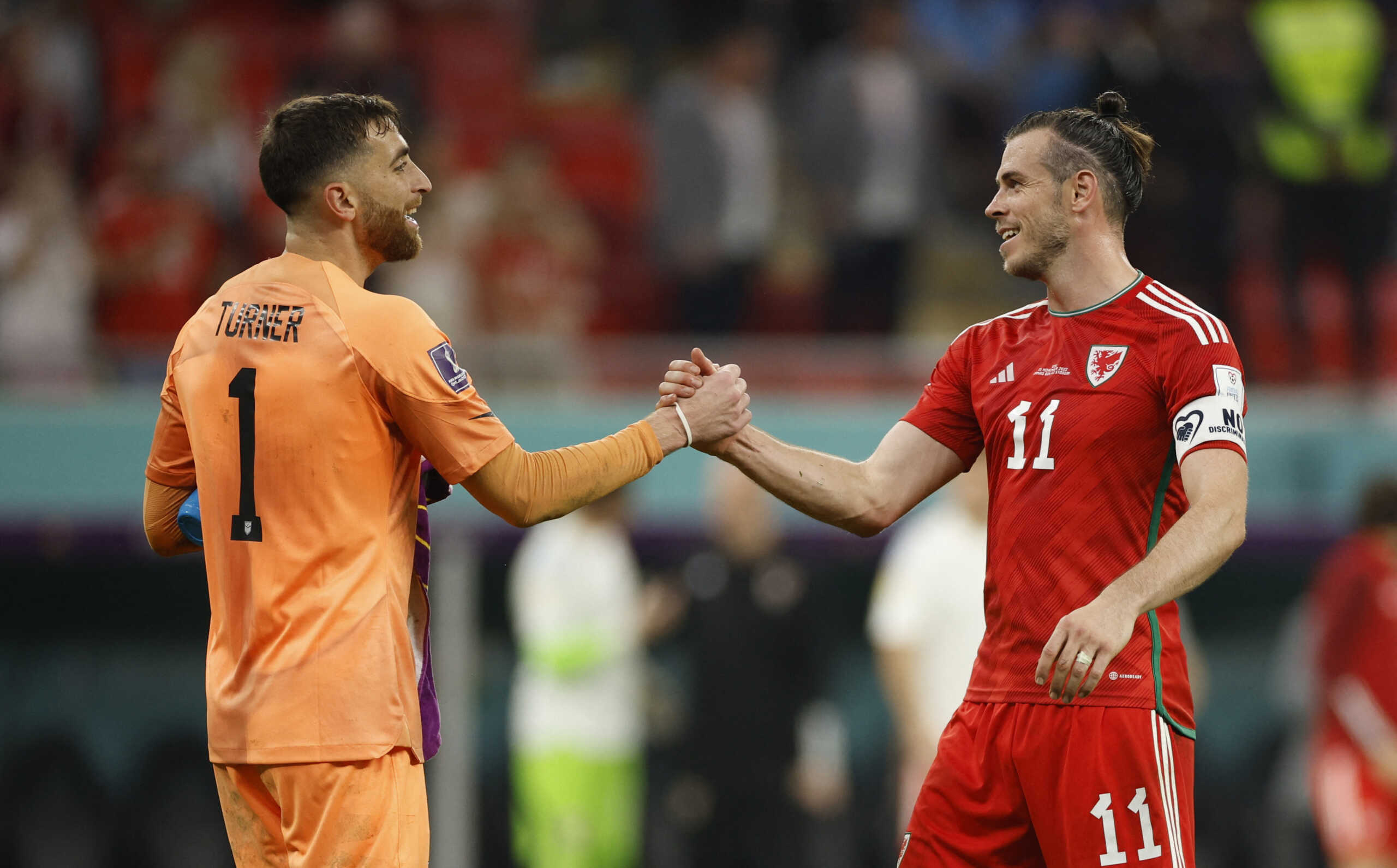 Soccer Football - FIFA World Cup Qatar 2022 - Group B - United States v Wales - Ahmad Bin Ali Stadium, Al Rayyan, Qatar - November 22, 2022 Wales' Gareth Bale shakes hands with Matt Turner of the U.S. after the match REUTERS