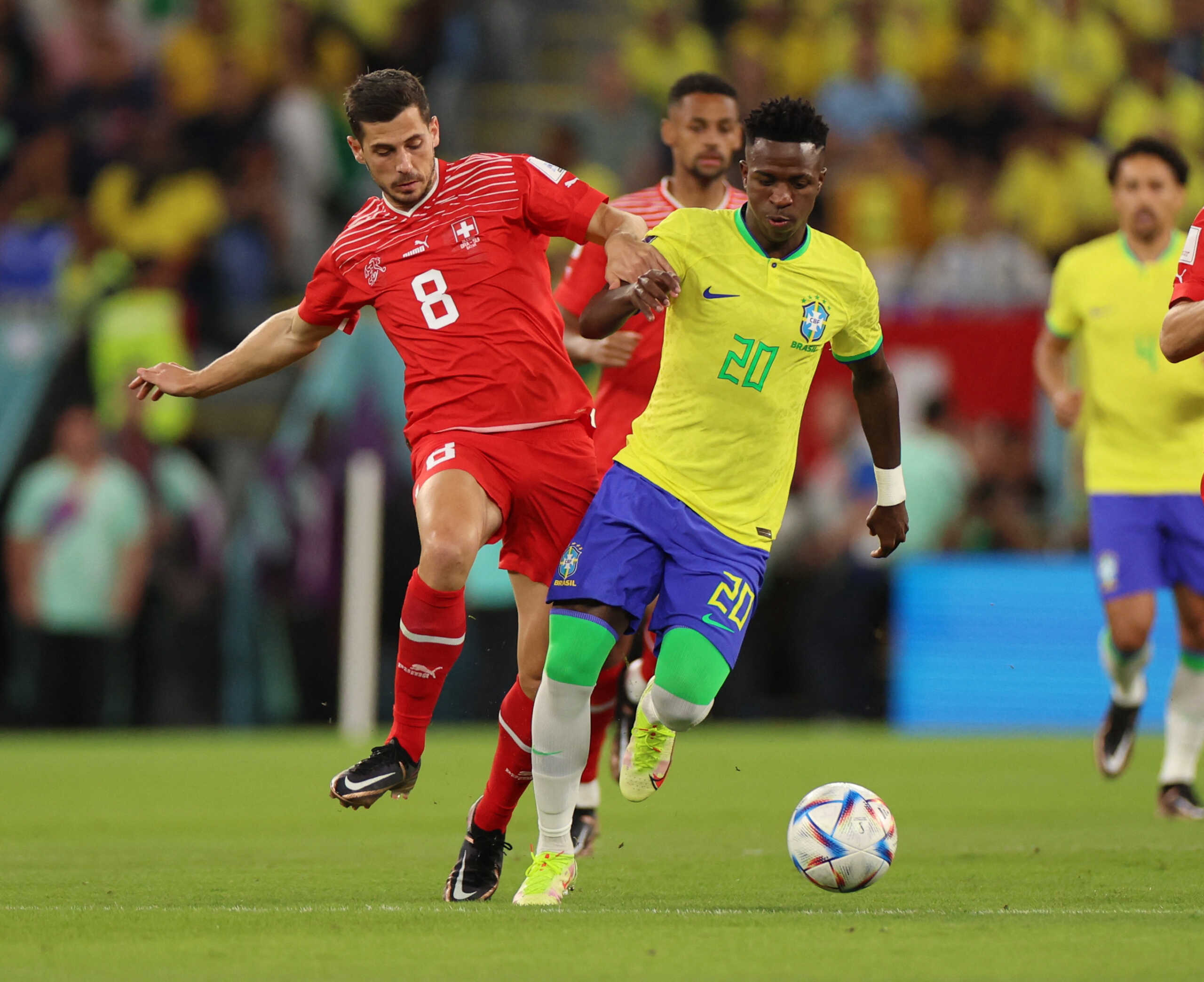 Soccer Football - FIFA World Cup Qatar 2022 - Group G - Brazil v Switzerland - Stadium 974, Doha, Qatar - November 28, 2022 Switzerland's Remo Freuler in action with Brazil's Vinicius Junior REUTERS