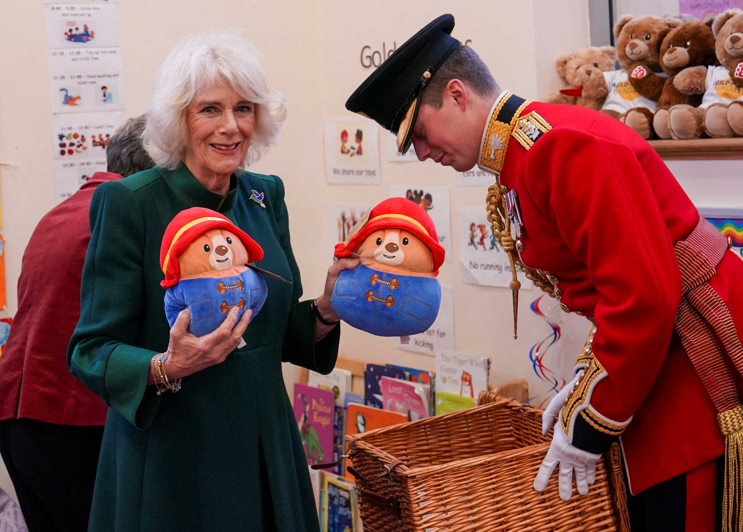 Camilla, the Queen consort, holds Paddington bears as she visits Barnardo's Nursery in Bow, London, Britain November 24, 2022. Arthur Edwards